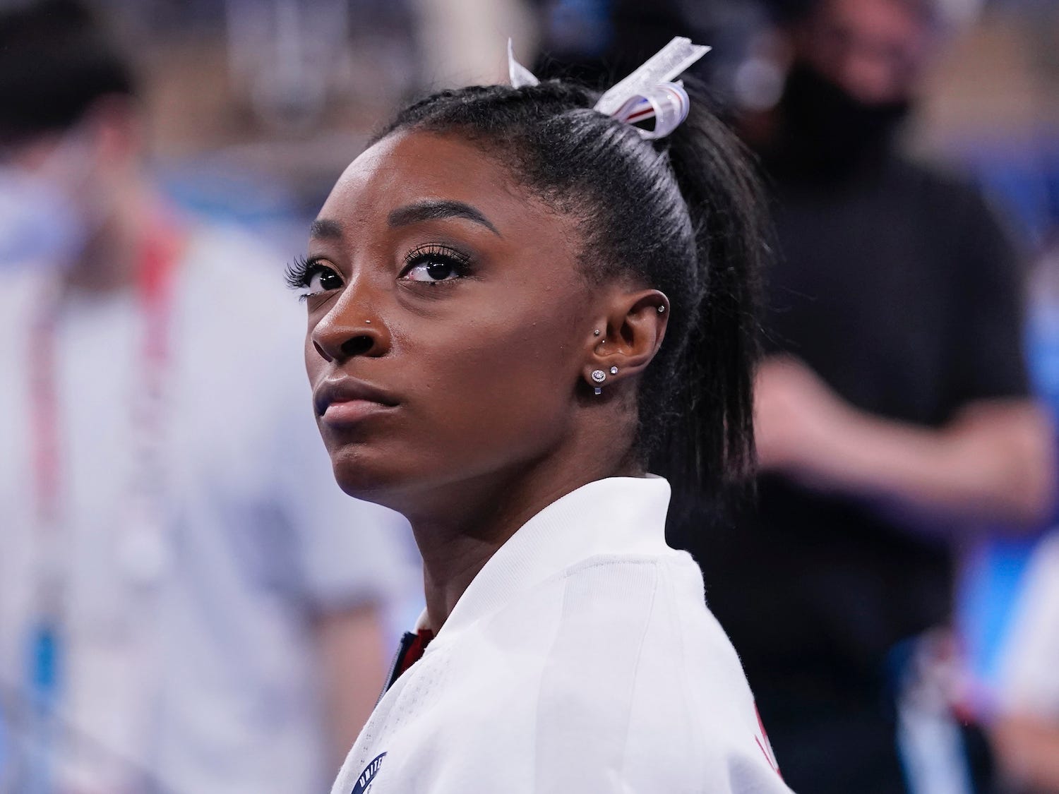 Simone Biles looks on during the Tokyo Olympics.