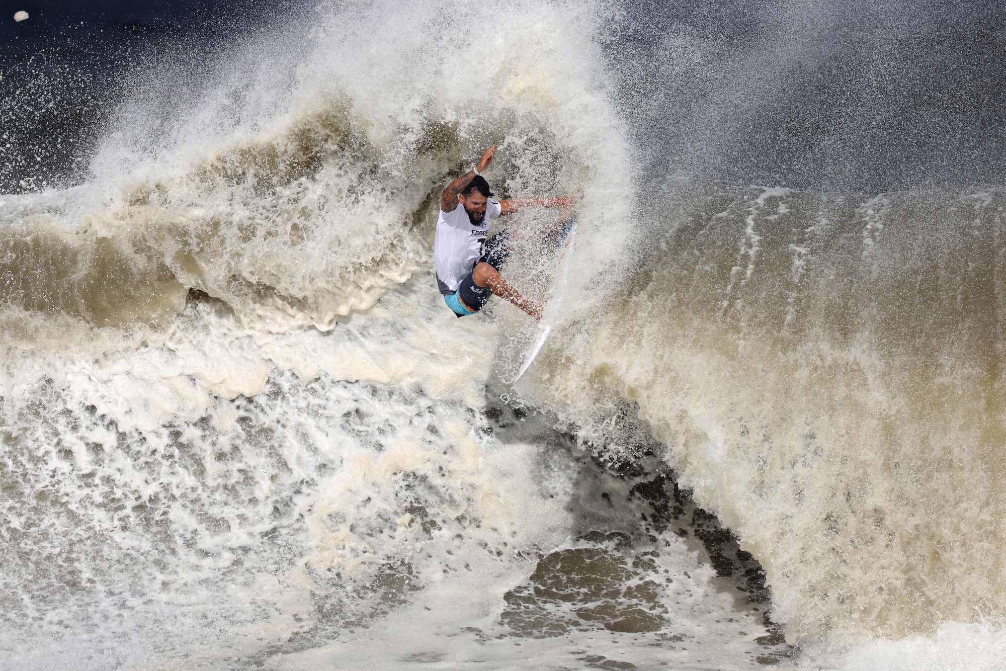 Italo Ferreira competes during the men's Surfing gold medal final.