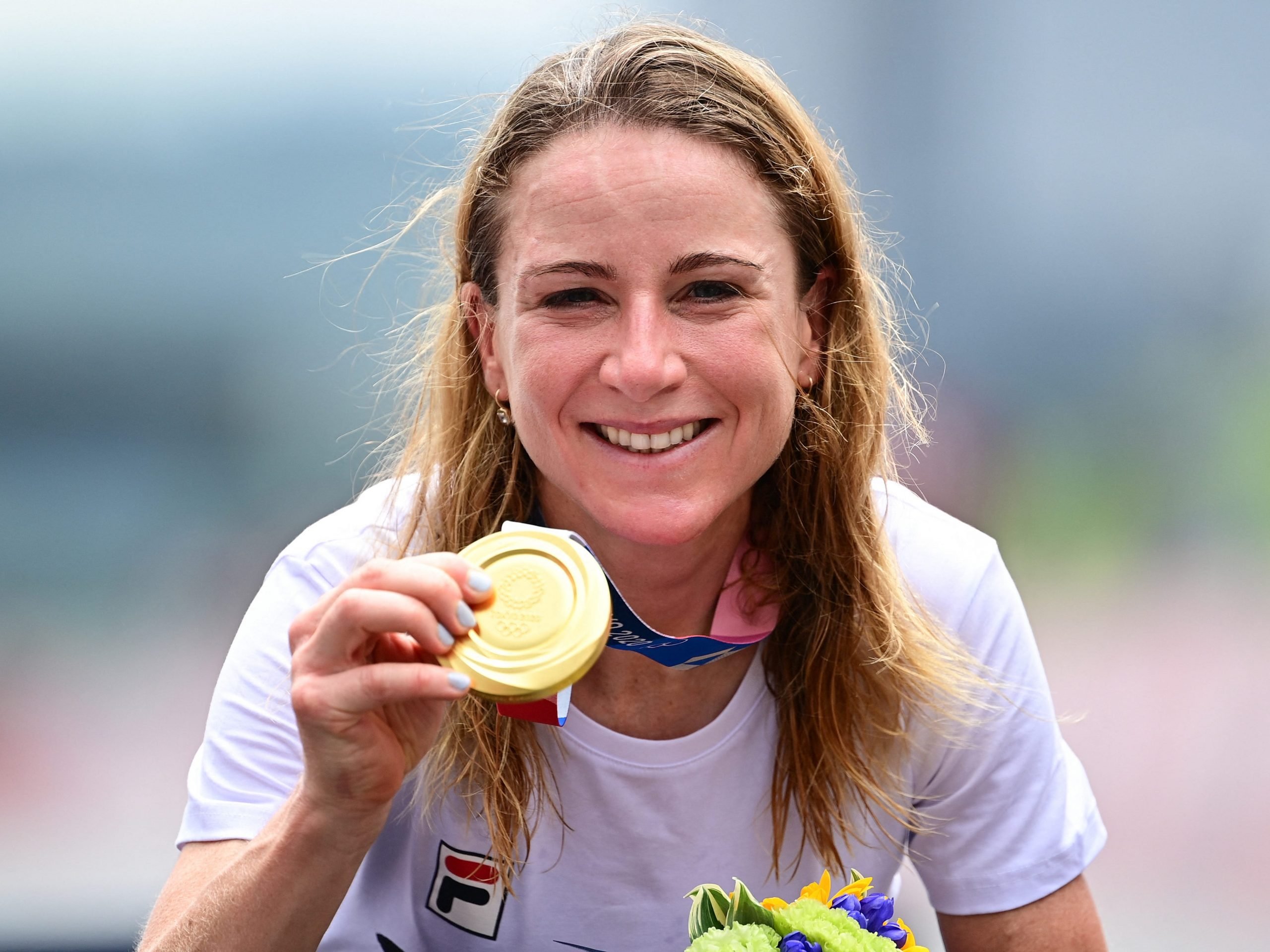 Gold medalist Netherlands' Annemiek Van Vleuten celebrates on the podium of the women's cycling road individual time trial during the Tokyo Olympics