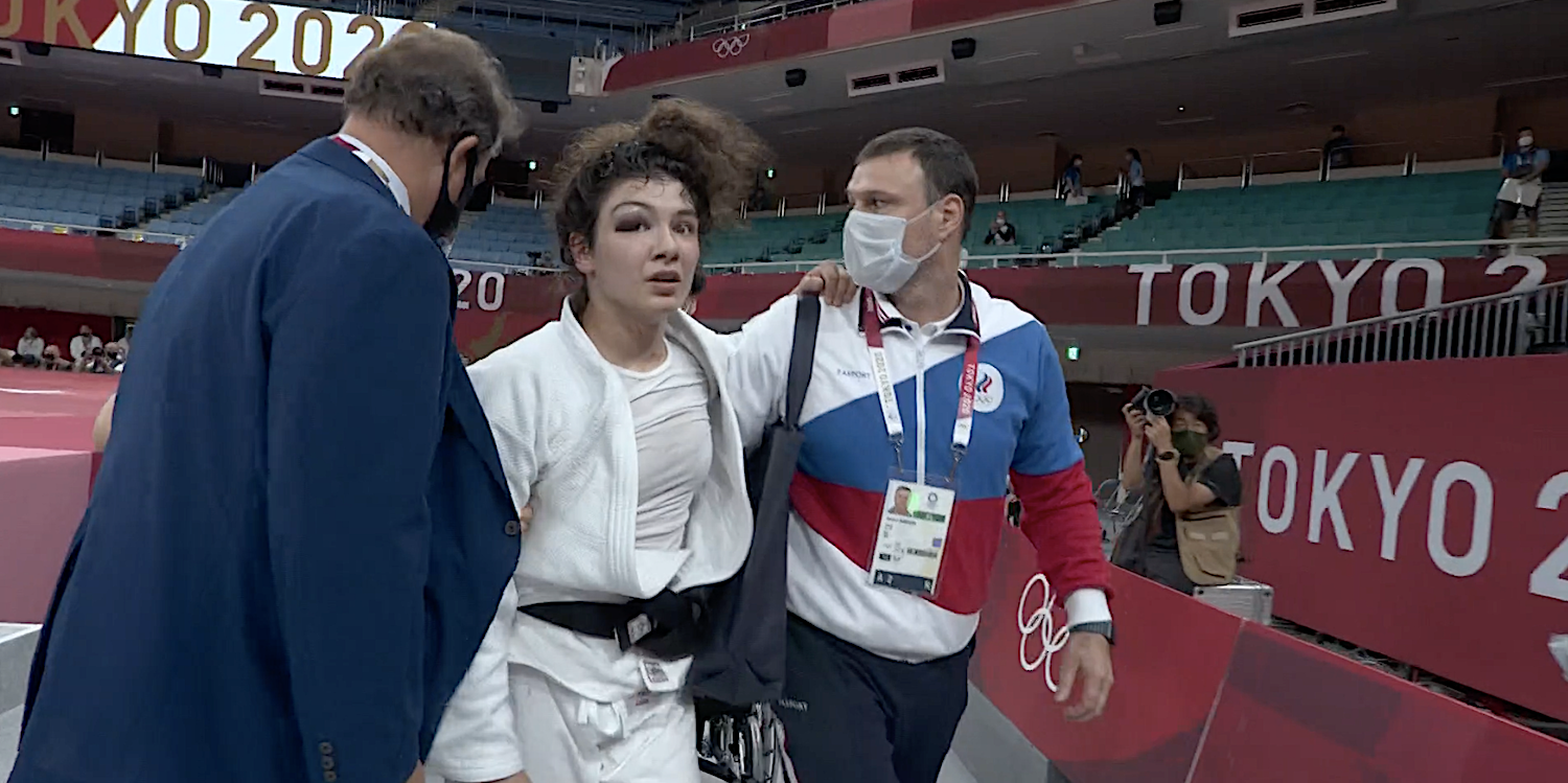 Russia's Madina Taimazova walks off mat after passing out at the Tokyo Olympics