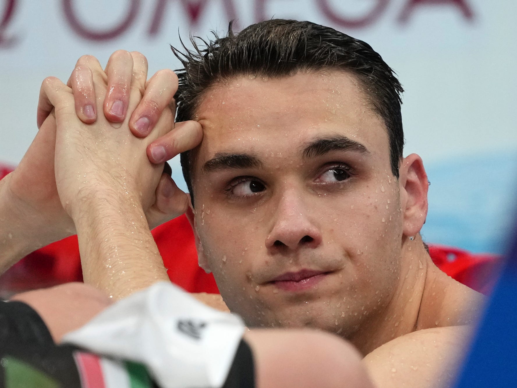 Kristof Milak looks on after the men's 200-meter butterfly at the Tokyo Olympics