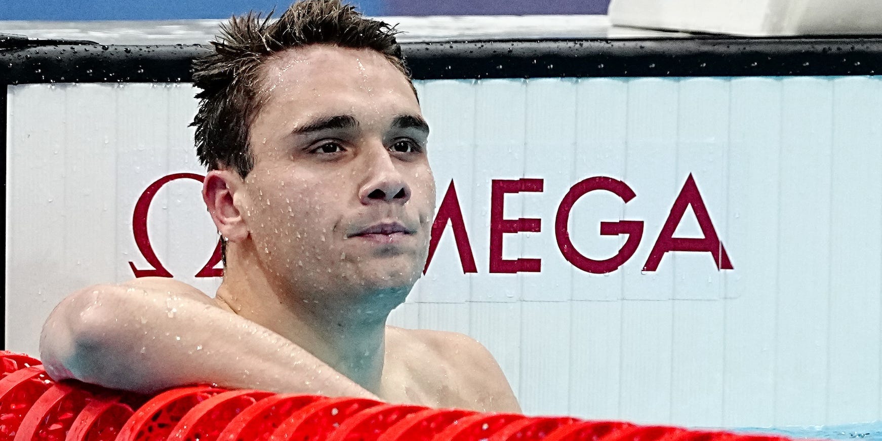 Kristof Milak looks up from the pool after the men's 200-meter butterfly final.