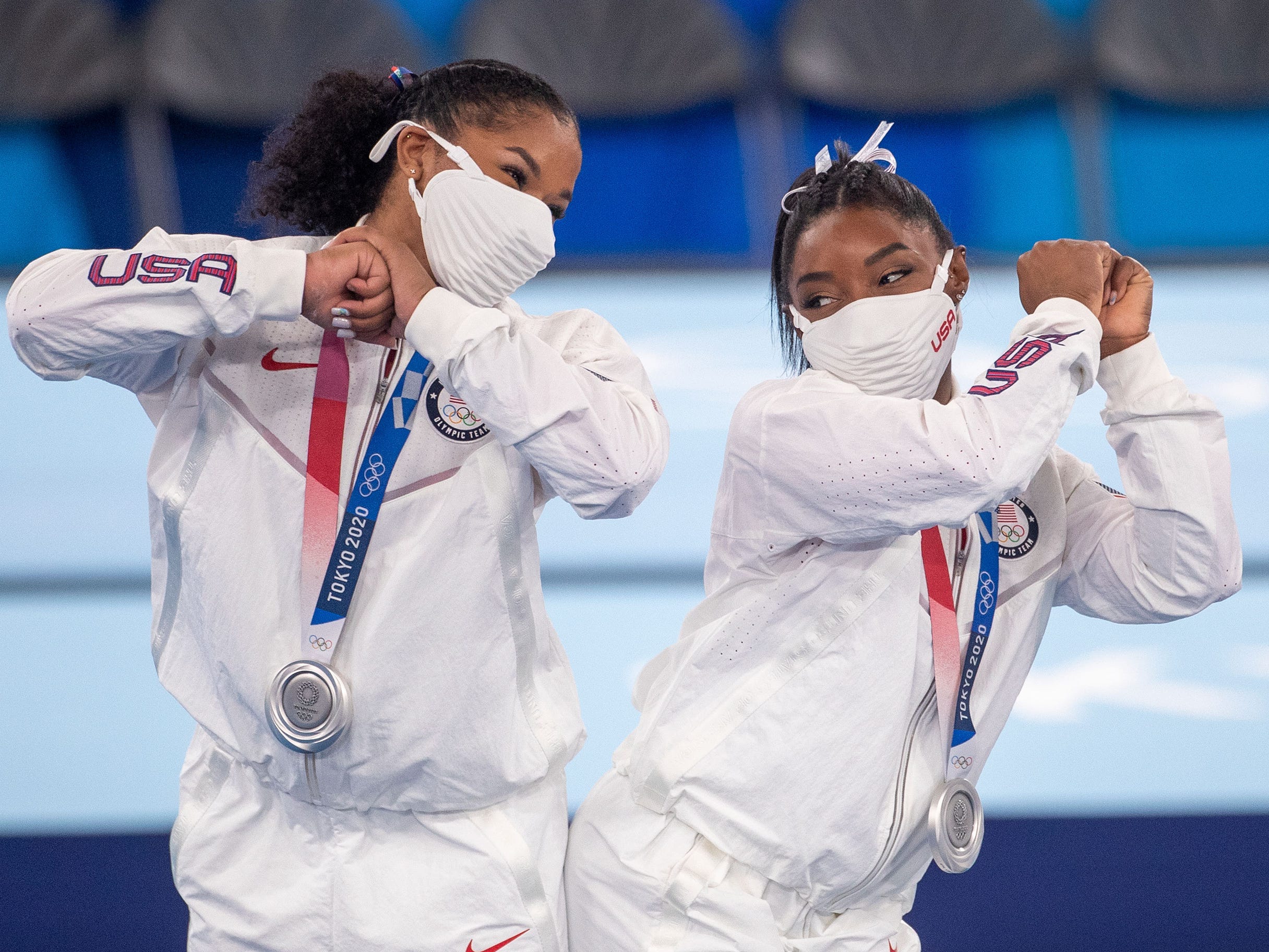 Simone Biles and Jordan Chiles of the United States celebrate after receiving their silver medals.