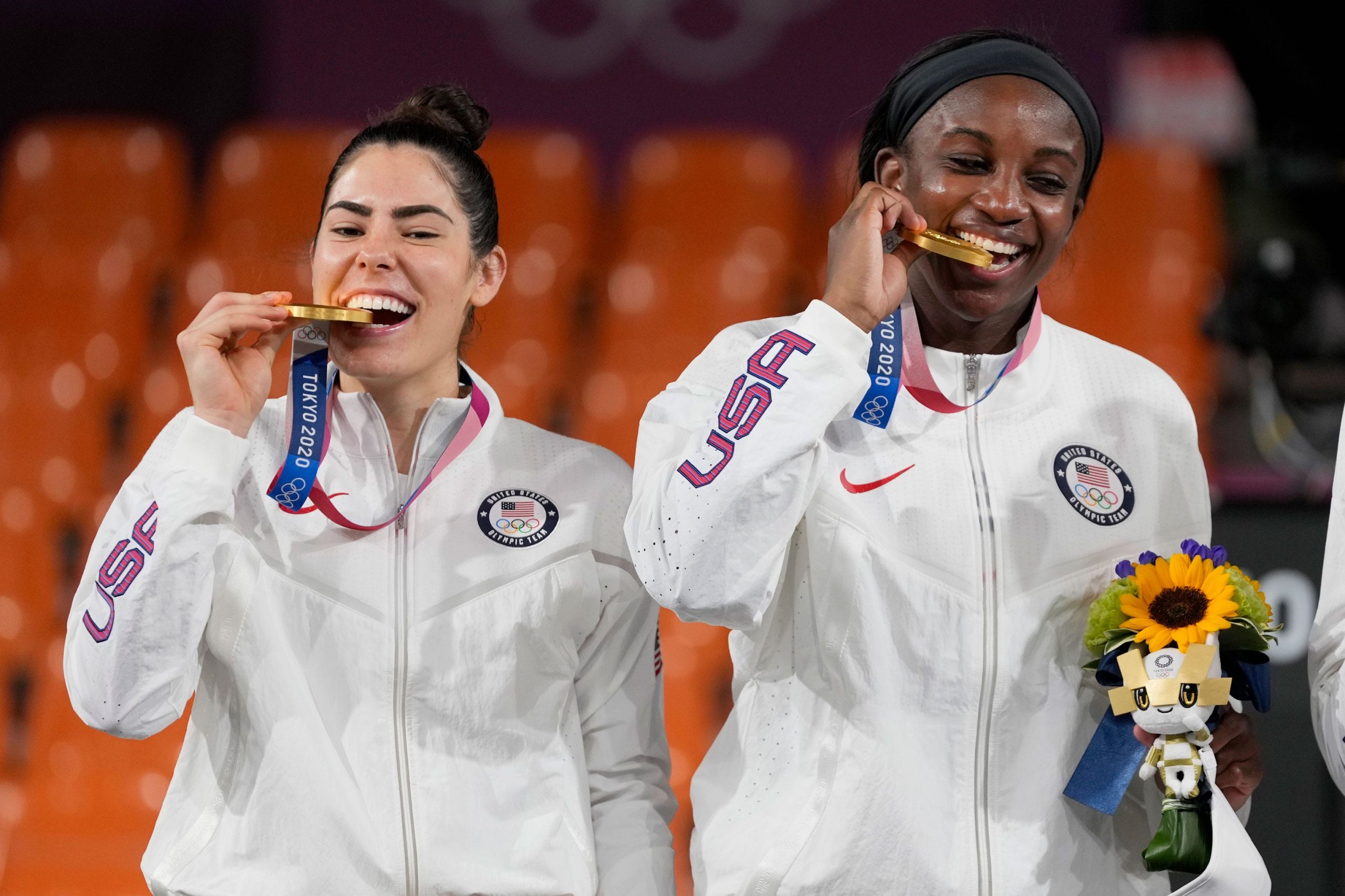 Kelsey Plum and Jackie Young pose with their gold medals at Tokyo 2020.