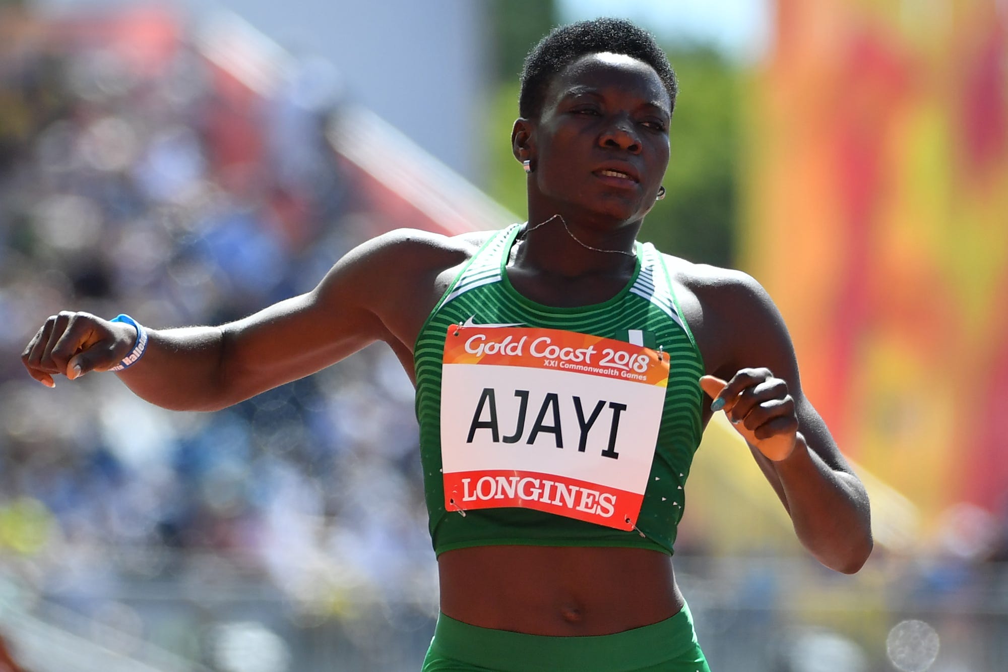 Nigeria's Yinka Ajayi competes in the athletics women's 400m heats during the 2018 Gold Coast Commonwealth Games at the Carrara Stadium on the Gold Coast