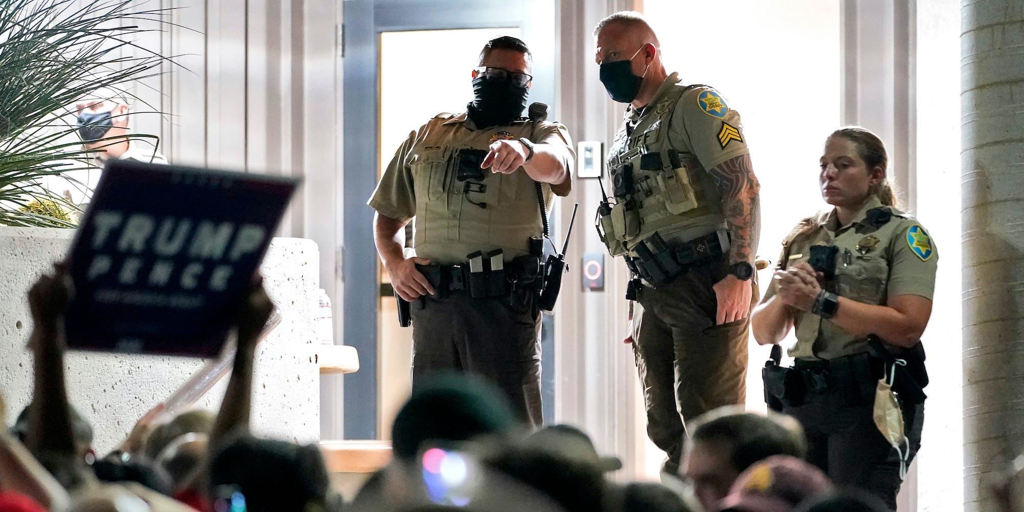 Maricopa County Sheriff's Deputies stand at the door of the Maricopa County Recorder's Office