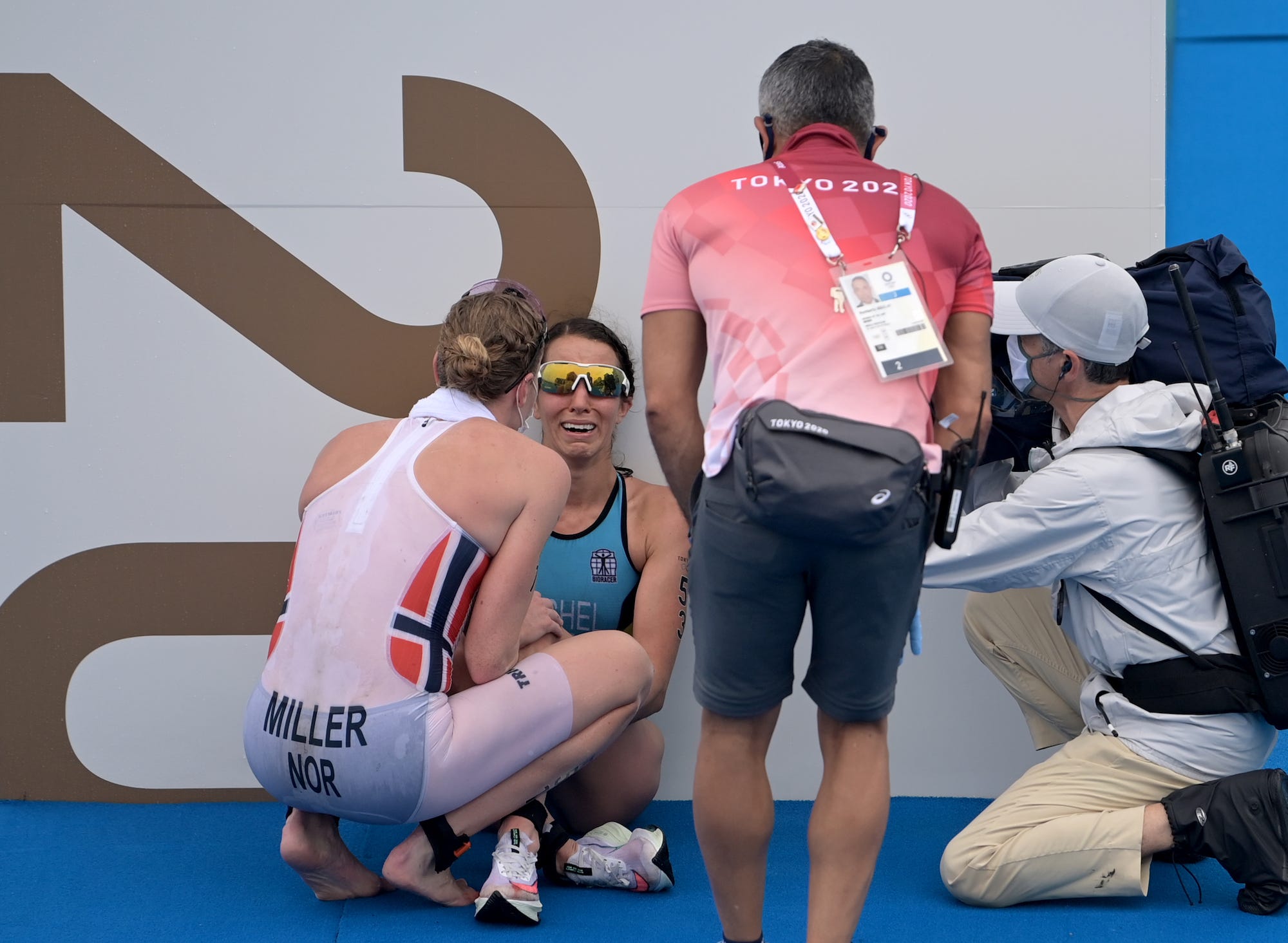 Lotte Miller encourages Claire Michel after the women's triathlete race had been run.