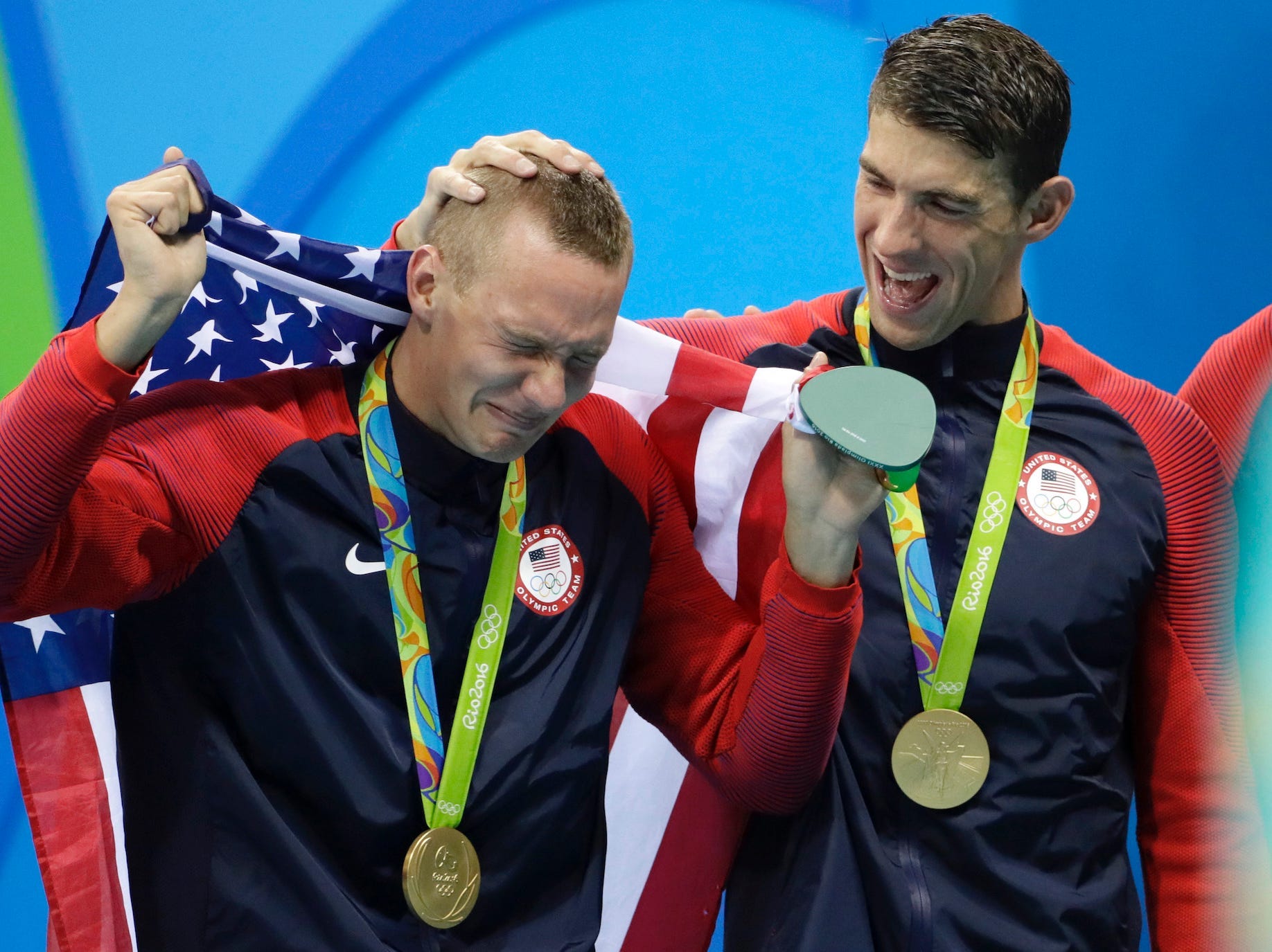 Michael Phelps consoles a crying Caeleb Dressel after the U.S. won the 4x100-meter relay at the Tokyo Olympics