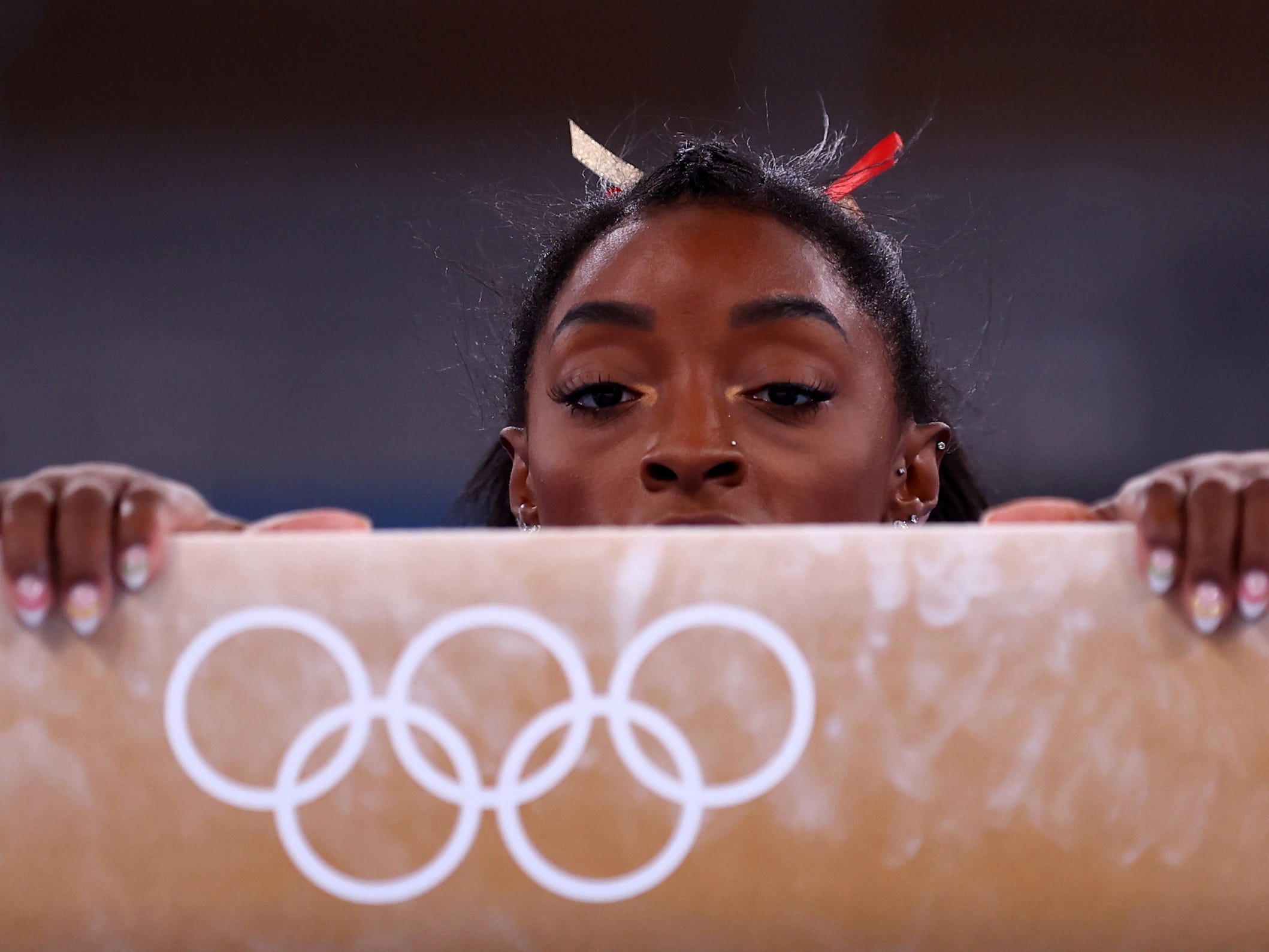 Simone Biles prepares for the balance beam.