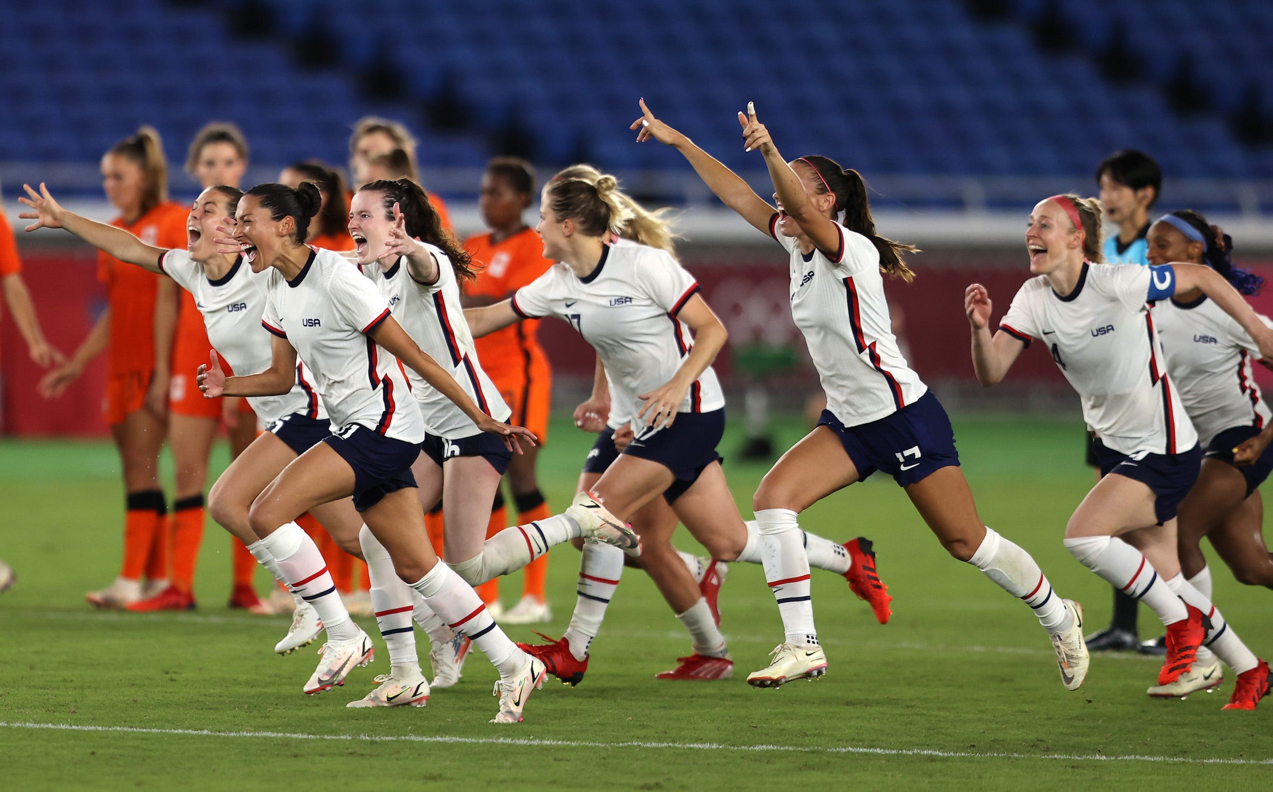 USWNT players celebrate surviving penalty kicks at the Tokyo Olympics.