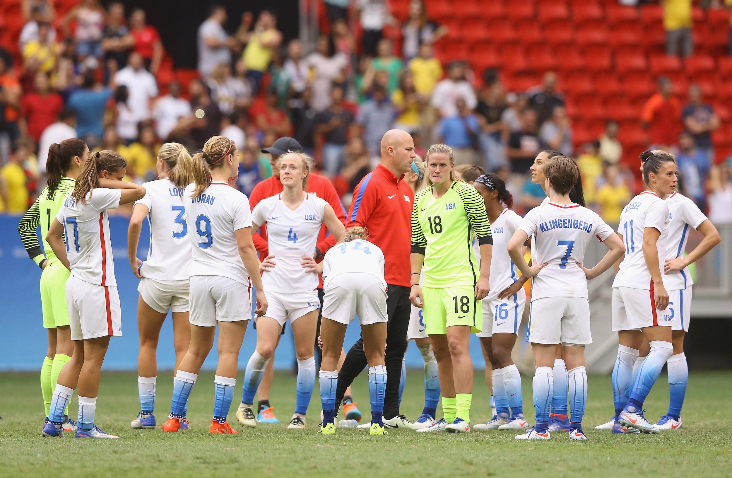 USWNT players react to their loss to Sweden in penalty kicks at the 2016 Olympics.