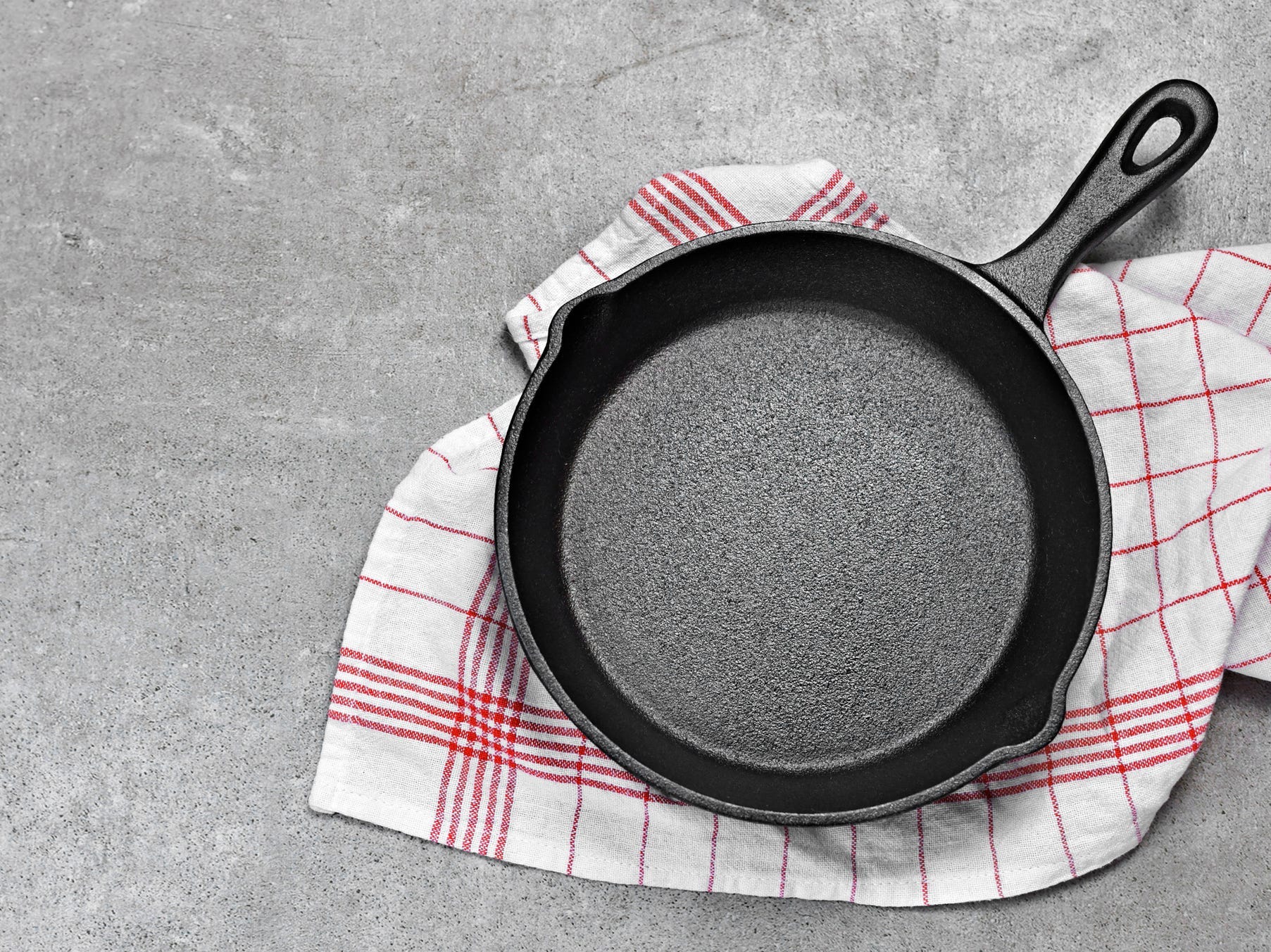 Cast iron pan on top of a towel.