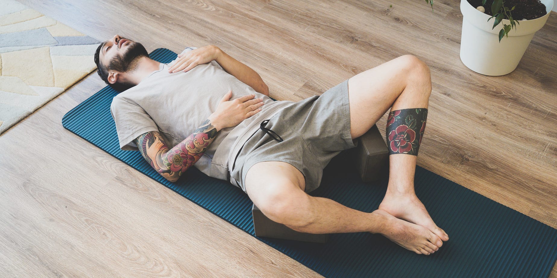 man practicing diaphragmatic breathing