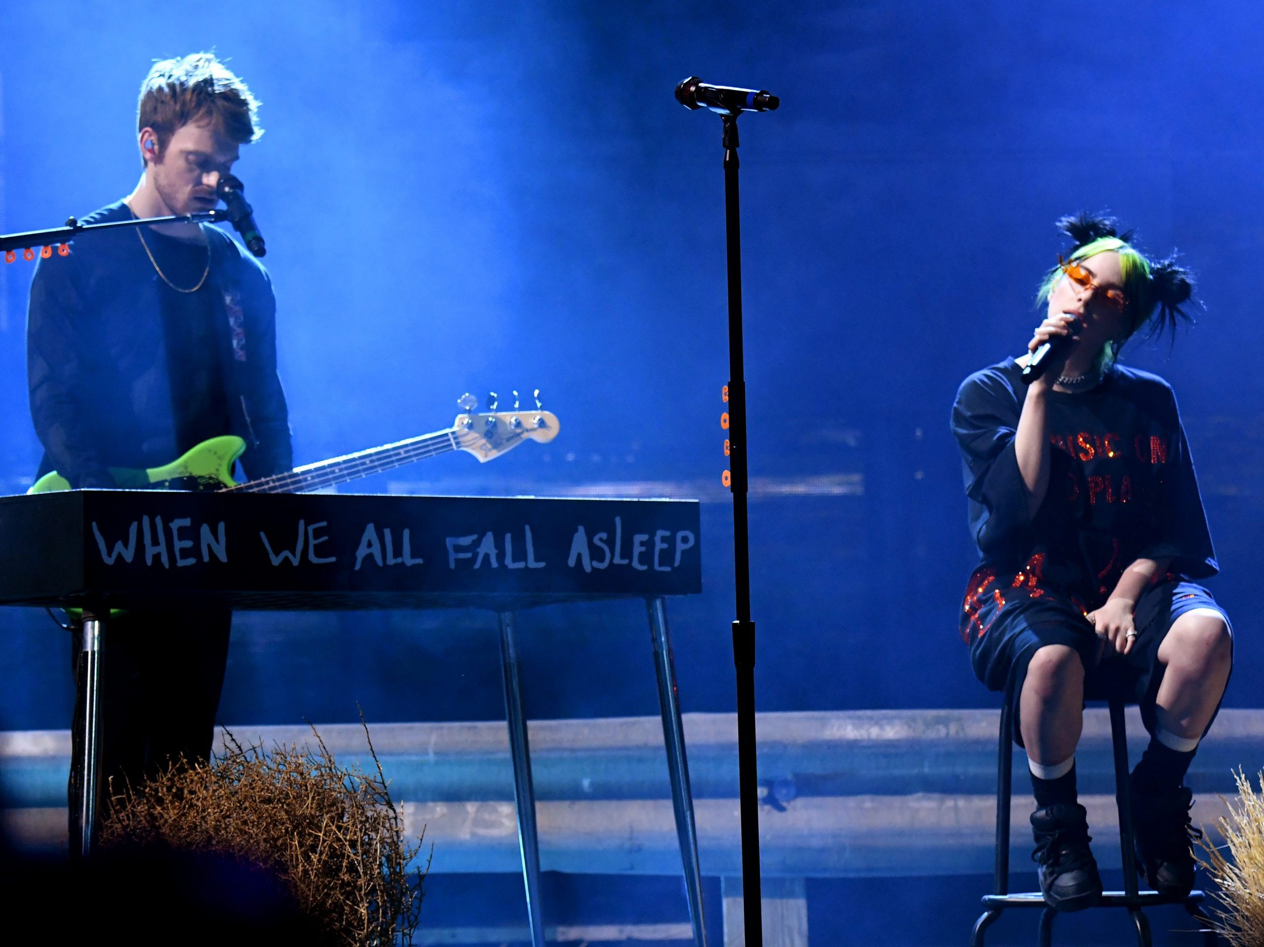 Finneas O'Connell and Billie Eilish perform onstage during the 2019 American Music Awards.