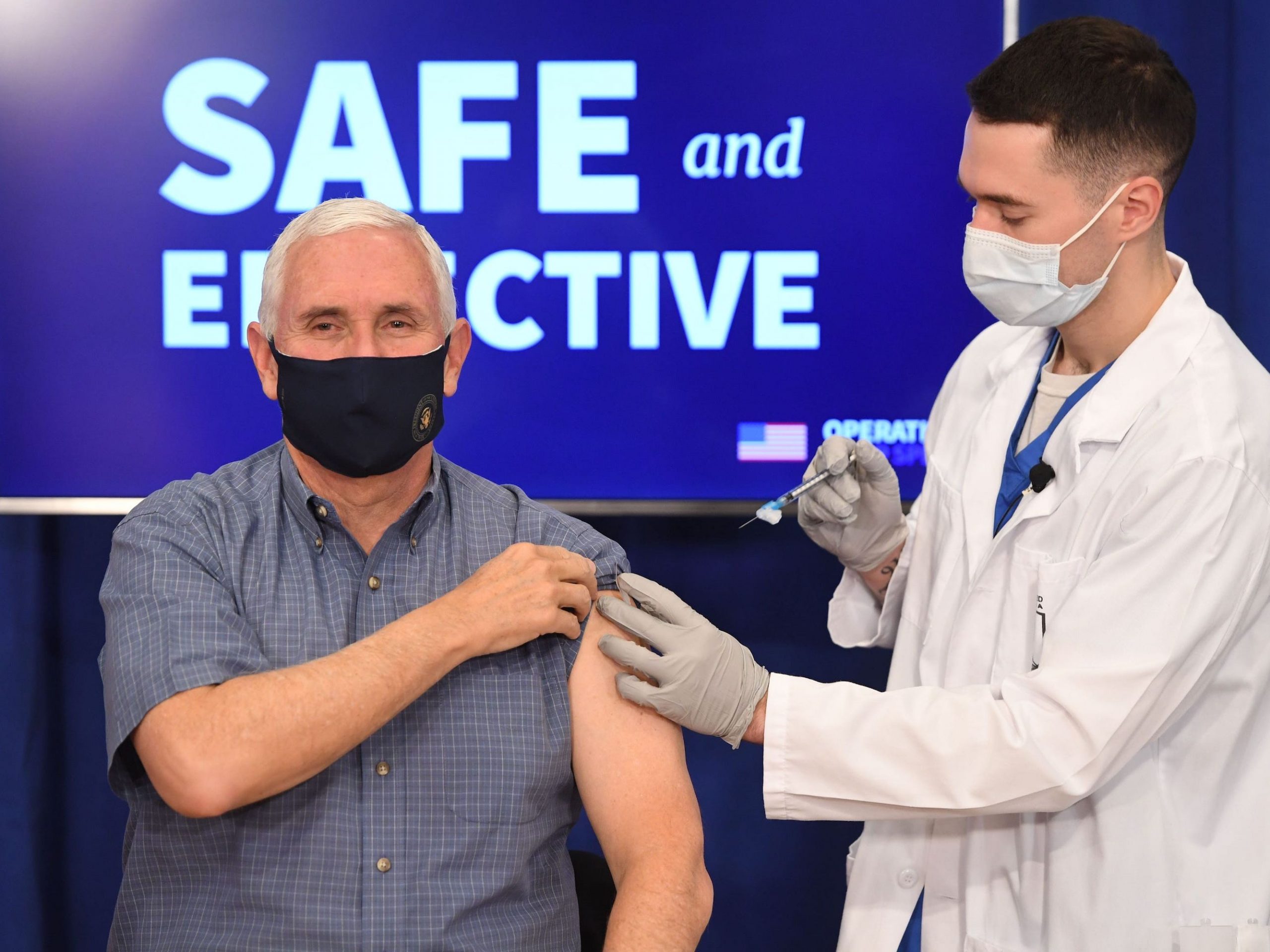 US Vice President Mike Pence receives the COVID-19 vaccine in the Eisenhower Executive Office Building in Washington, DC, December 18, 2020. (Photo by SAUL LOEB / AFP) (Photo by SAUL LOEB/AFP via Getty Images)