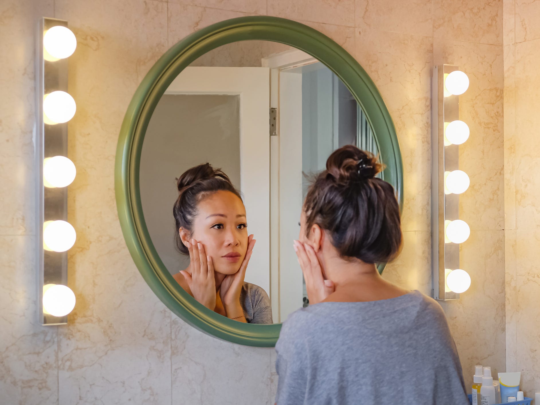 looking in mirror skincare skin acne face wash