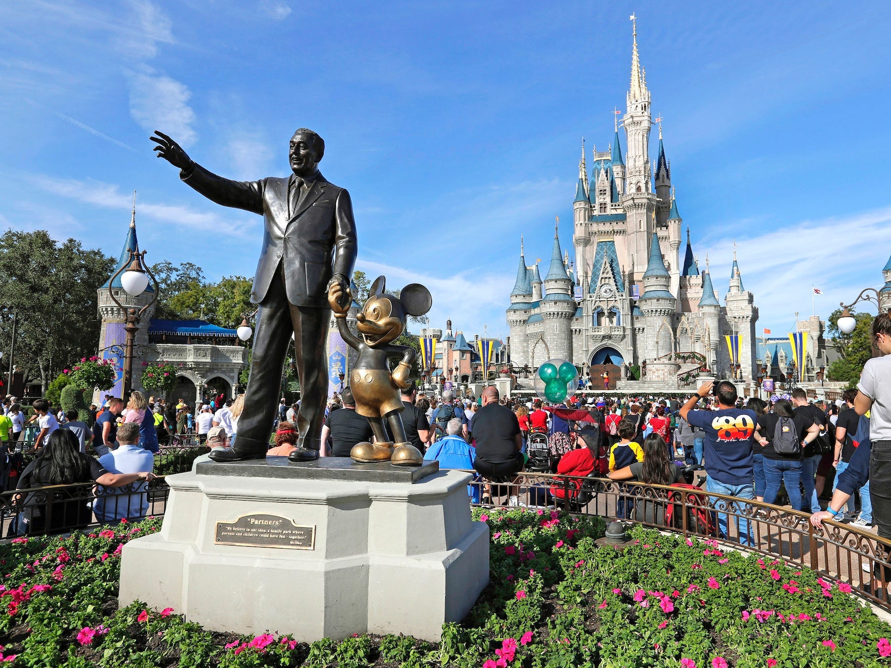 People visit Disney World's Magic Kingdom on March 28, 2019.