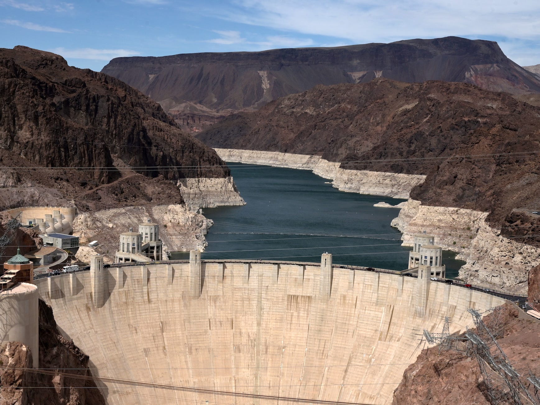 lake mead's low waters expose pale cliffs behind the hoover dam