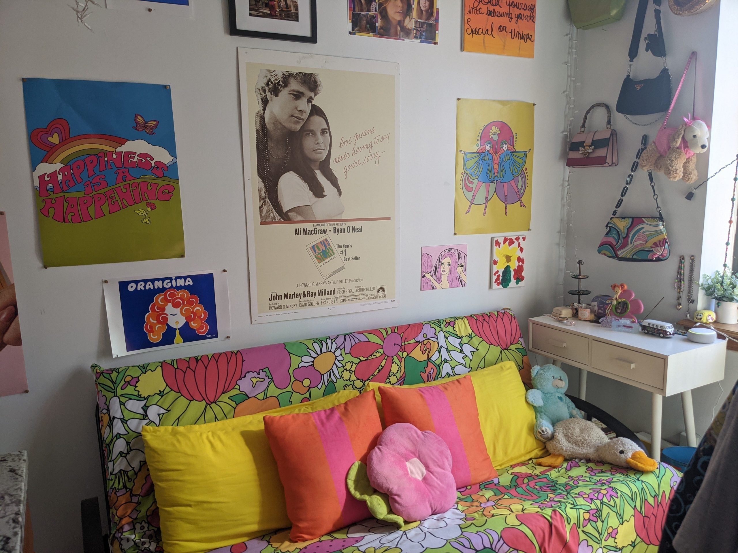 A futon with wall art above it