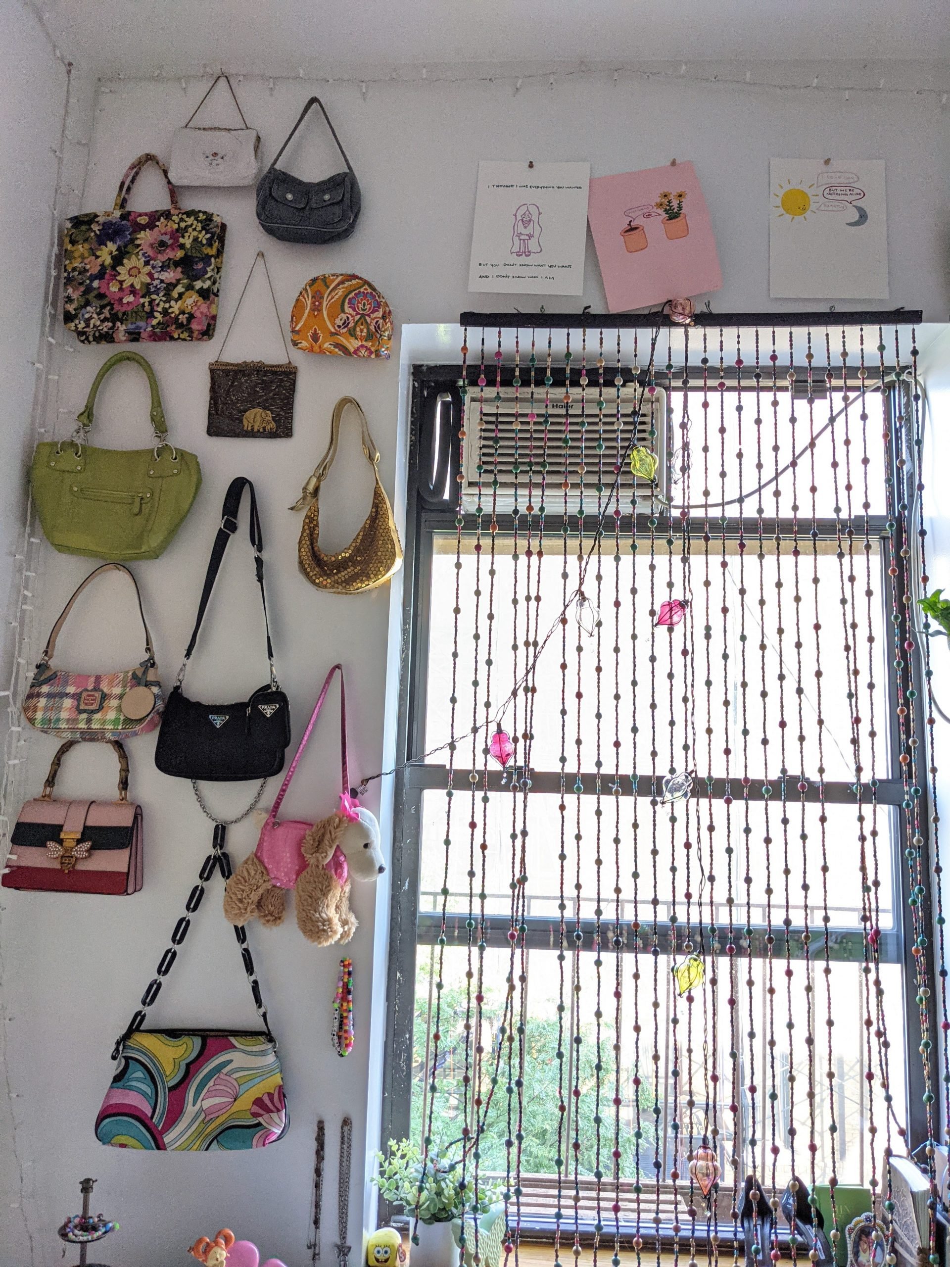 a wall with purses hung on it