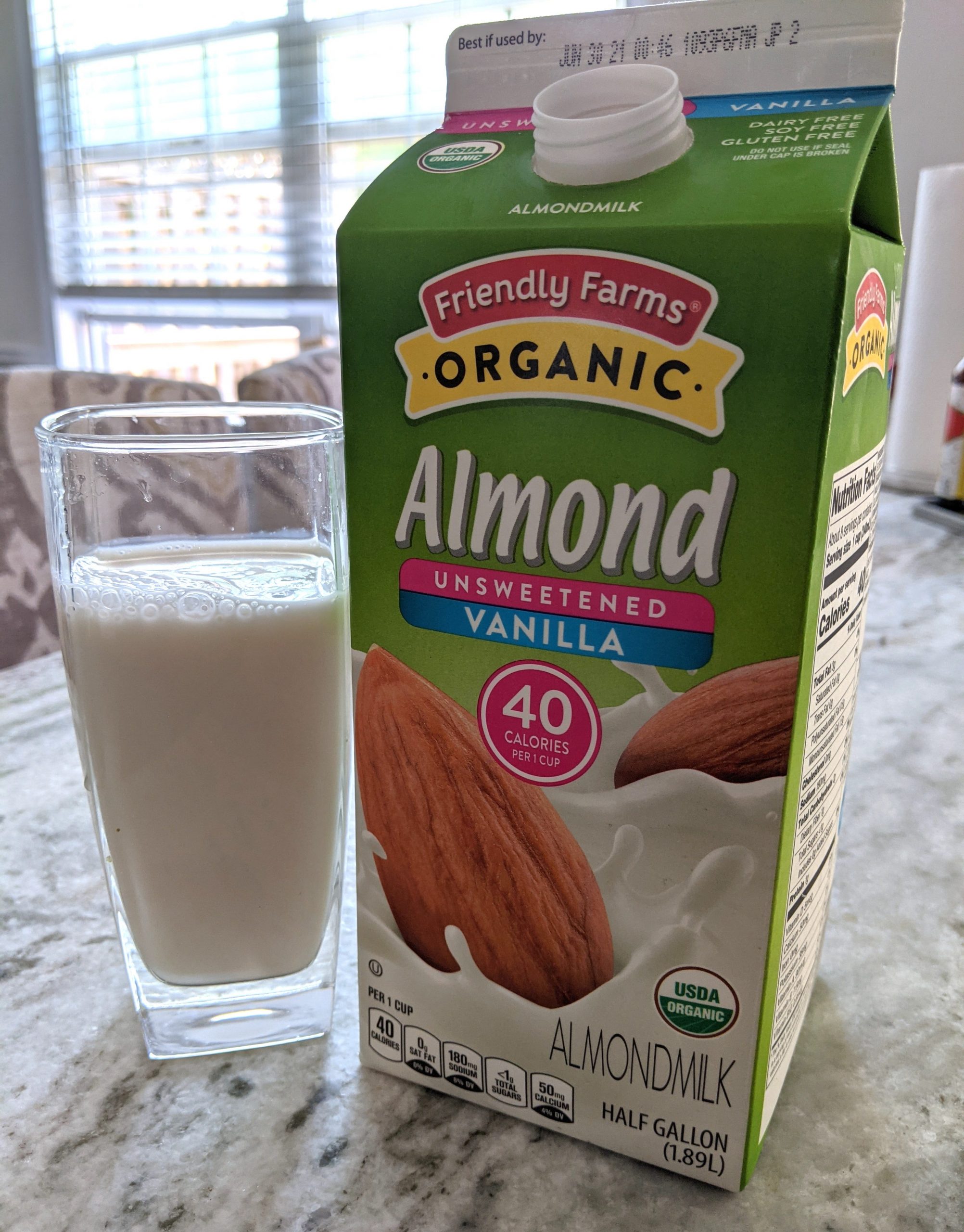 Aldi Almond milk in glass and in regular carton