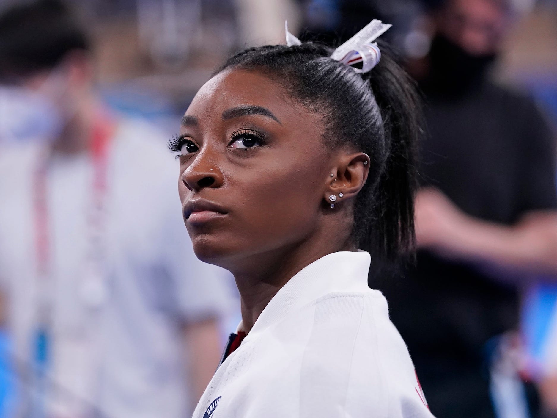 Simone Biles, of the United States, waits for her turn to perform during the artistic gymnastics women's final at the 2020 Summer Olympics, Tuesday, July 27, 2021, in Tokyo.