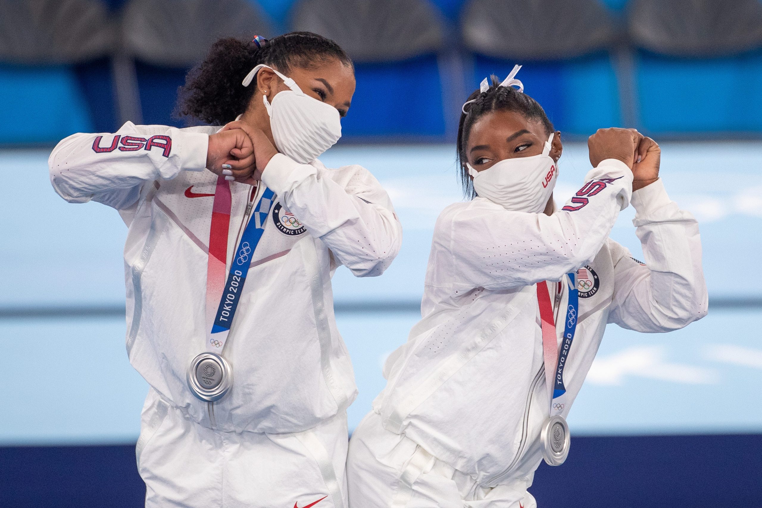 Jordan Chiles and Simone Biles butt bump face masks