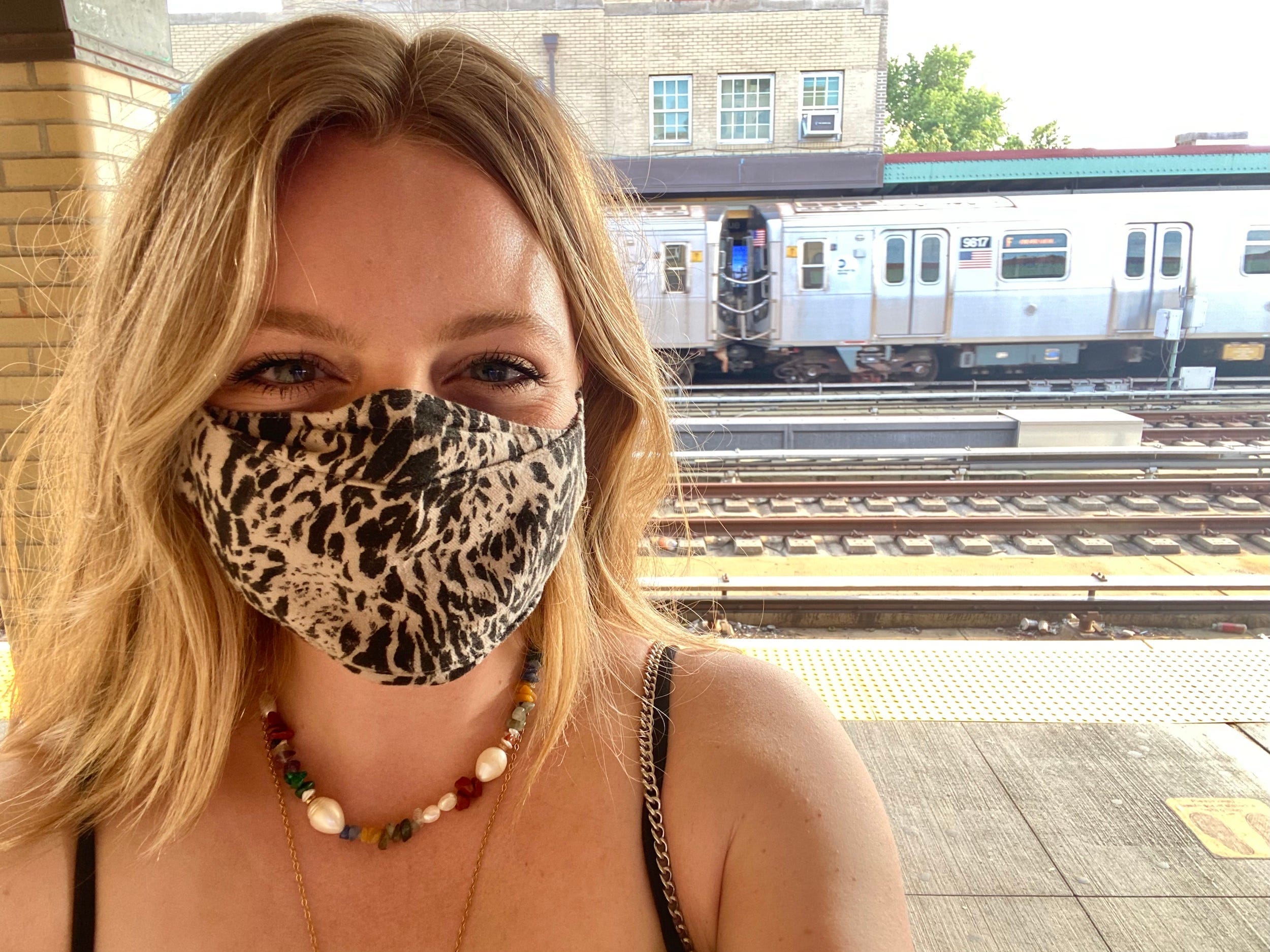 Woman wearing mask on New York City subway platform