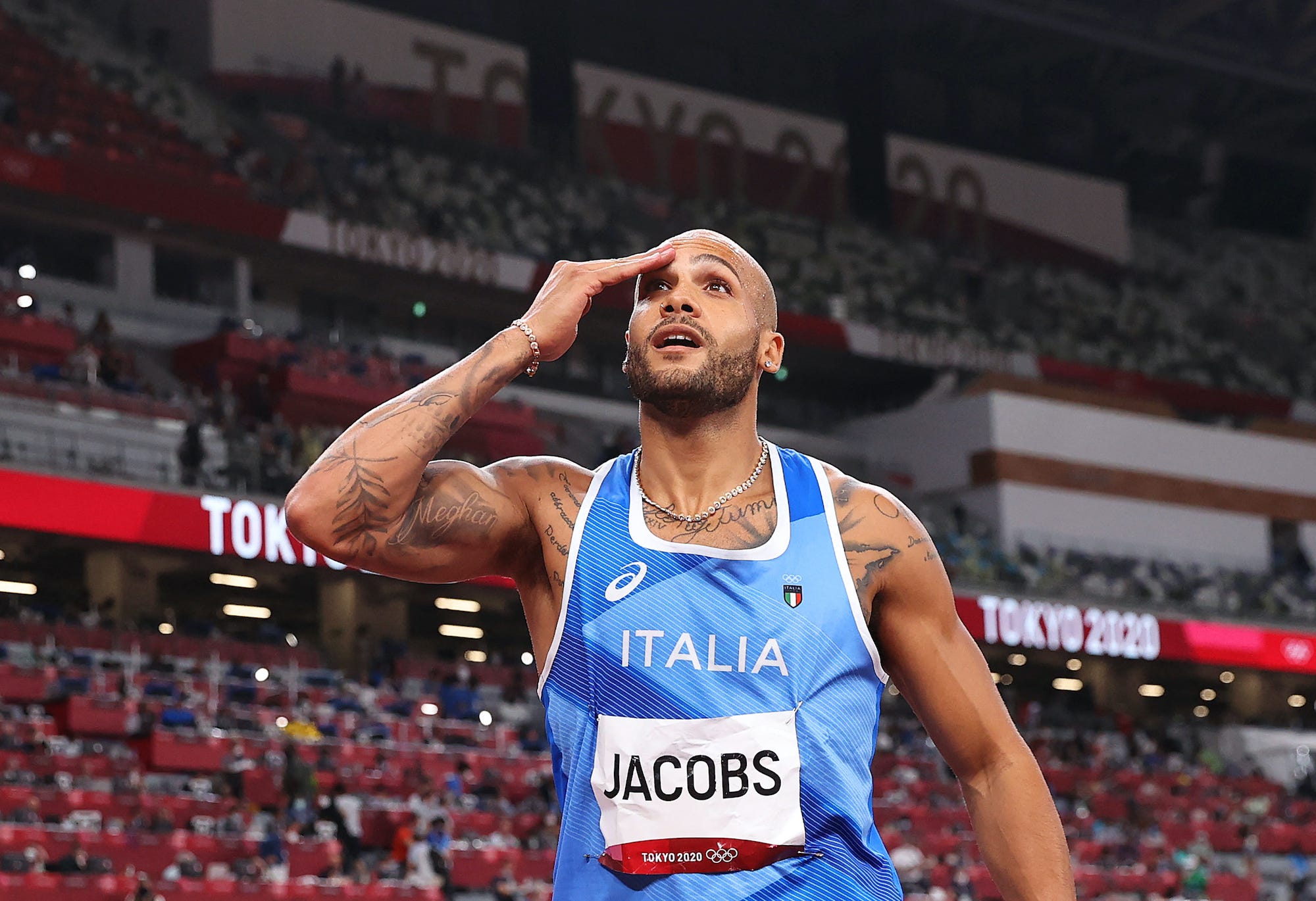 Lamont Marcell Jacobs appears in disbelief when he realizes he's won Olympic gold in the 100-meter final.