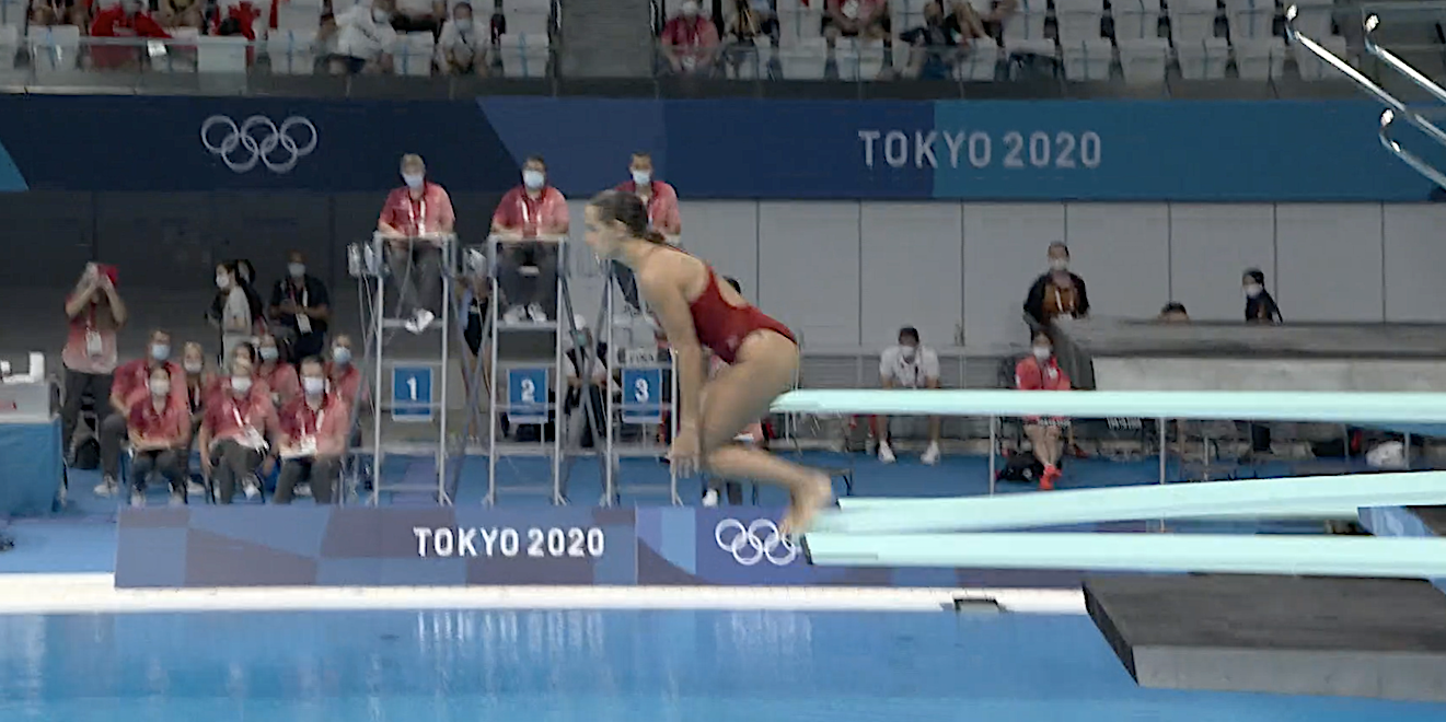 Screeshot shows Pamela Ware diving into the pool at the Tokyo Olympics