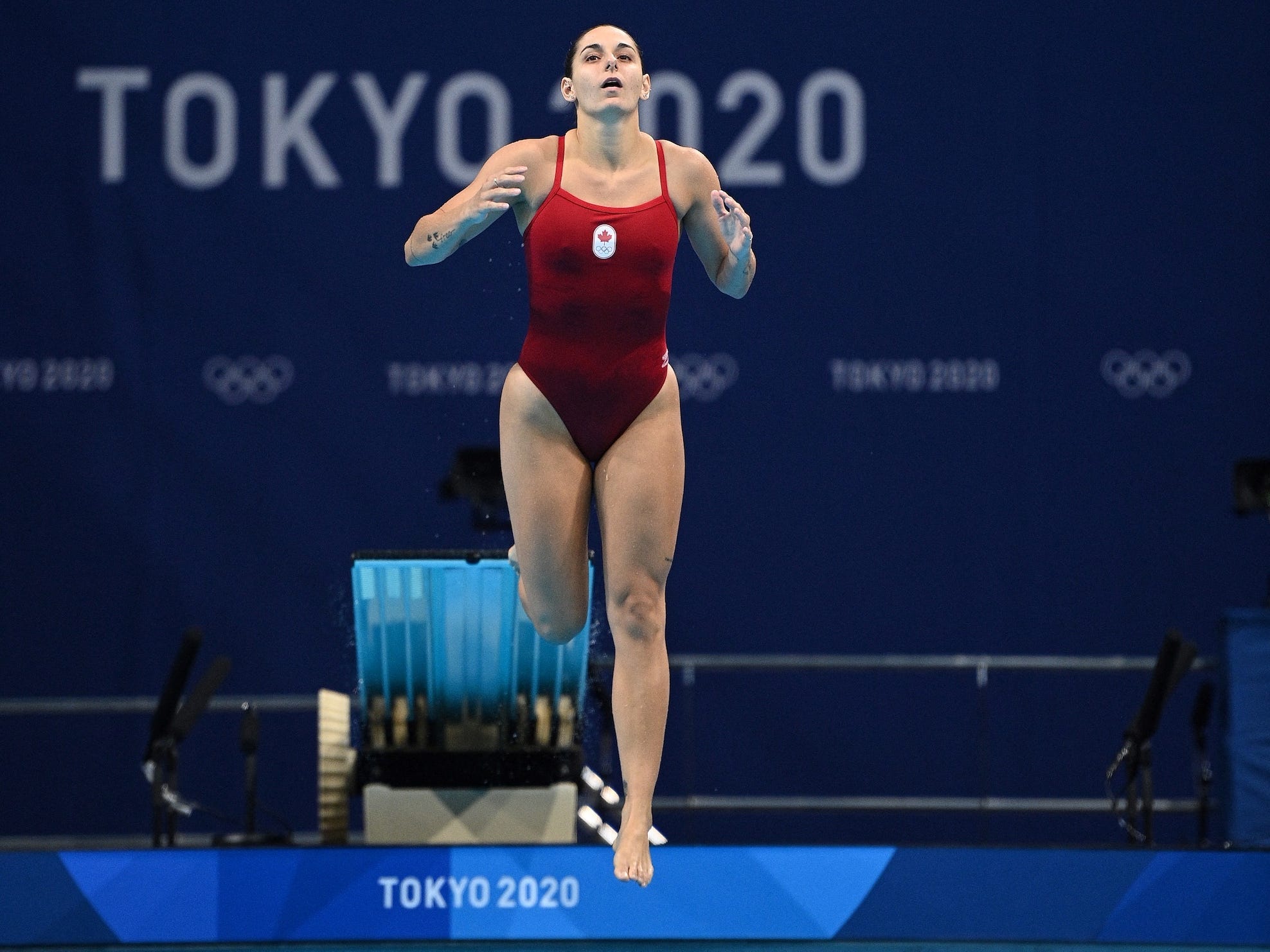 Pamela Ware slips on the diving board at the Olympics.