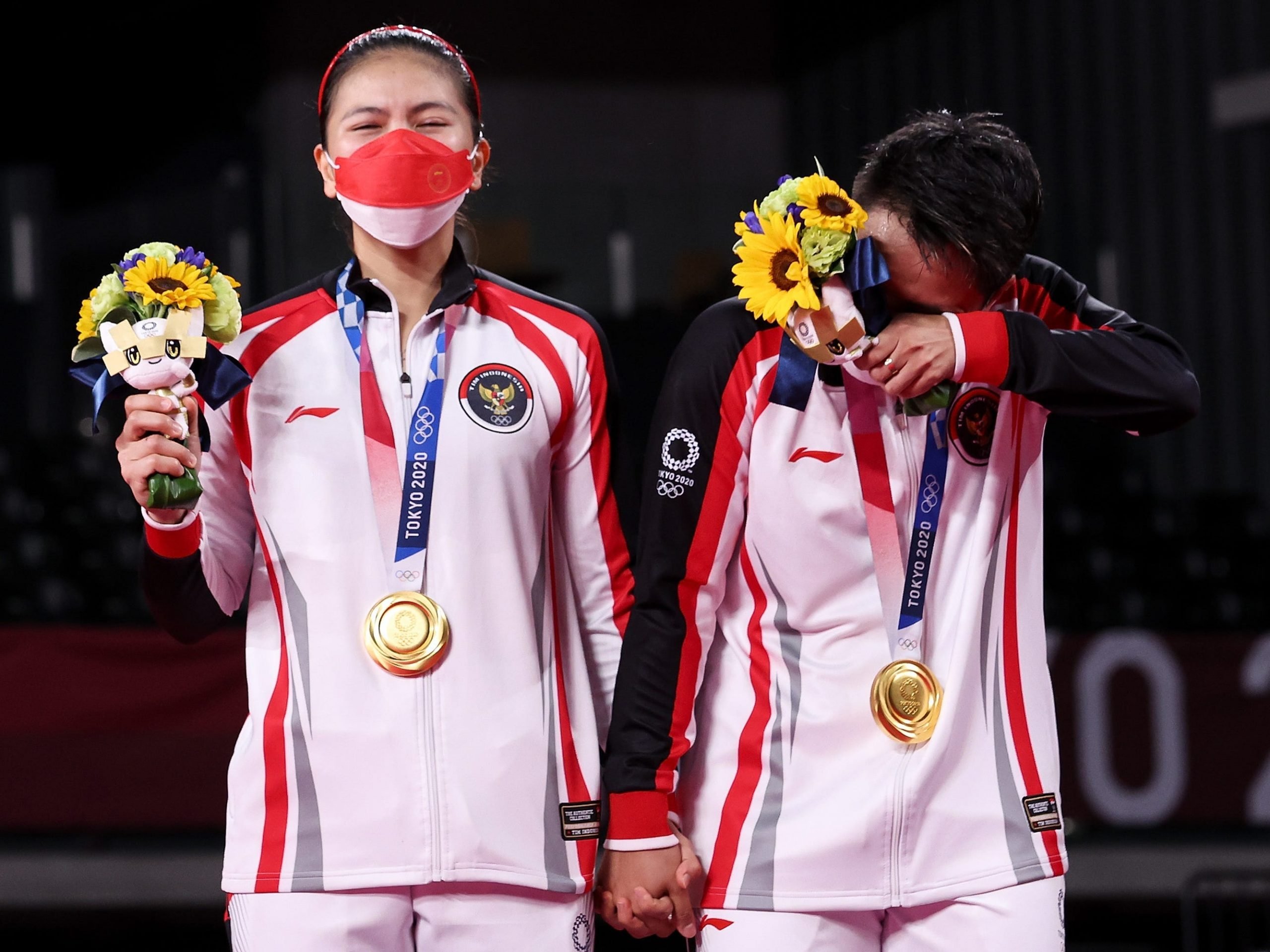 Greysia Polli and Apriyani Rahayu crying as they are awarded their medals at the Tokyo Olympics