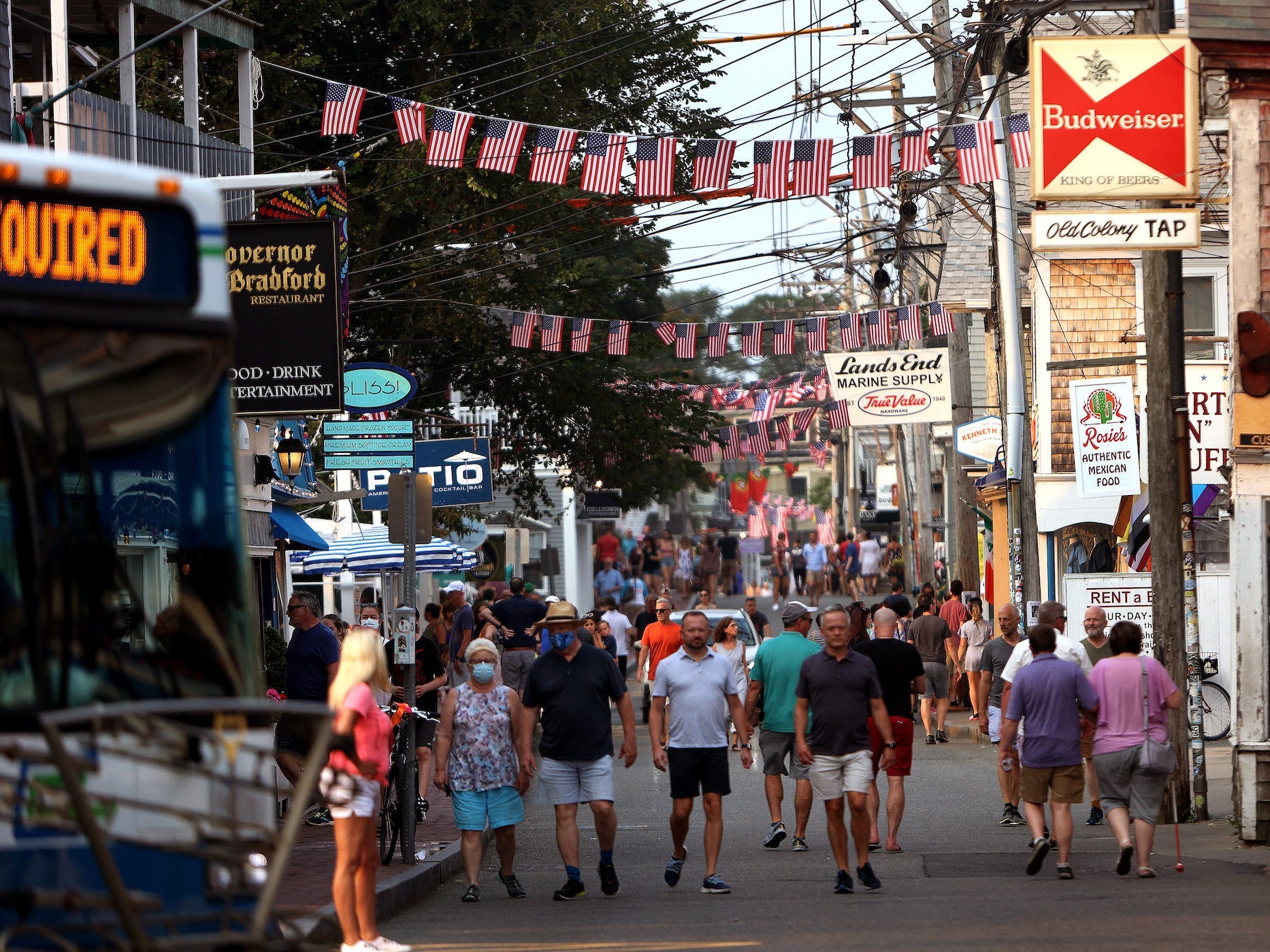 commercial street in provincetown draped with flags