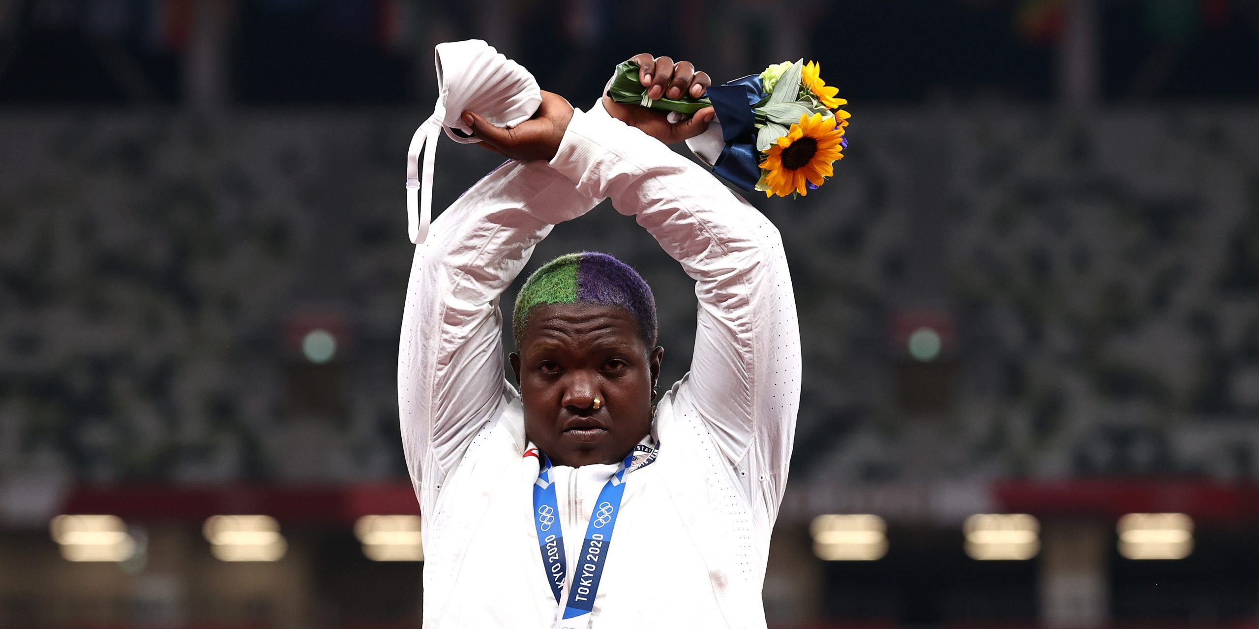Raven Saunders raises her arms at the Tokyo Olympics