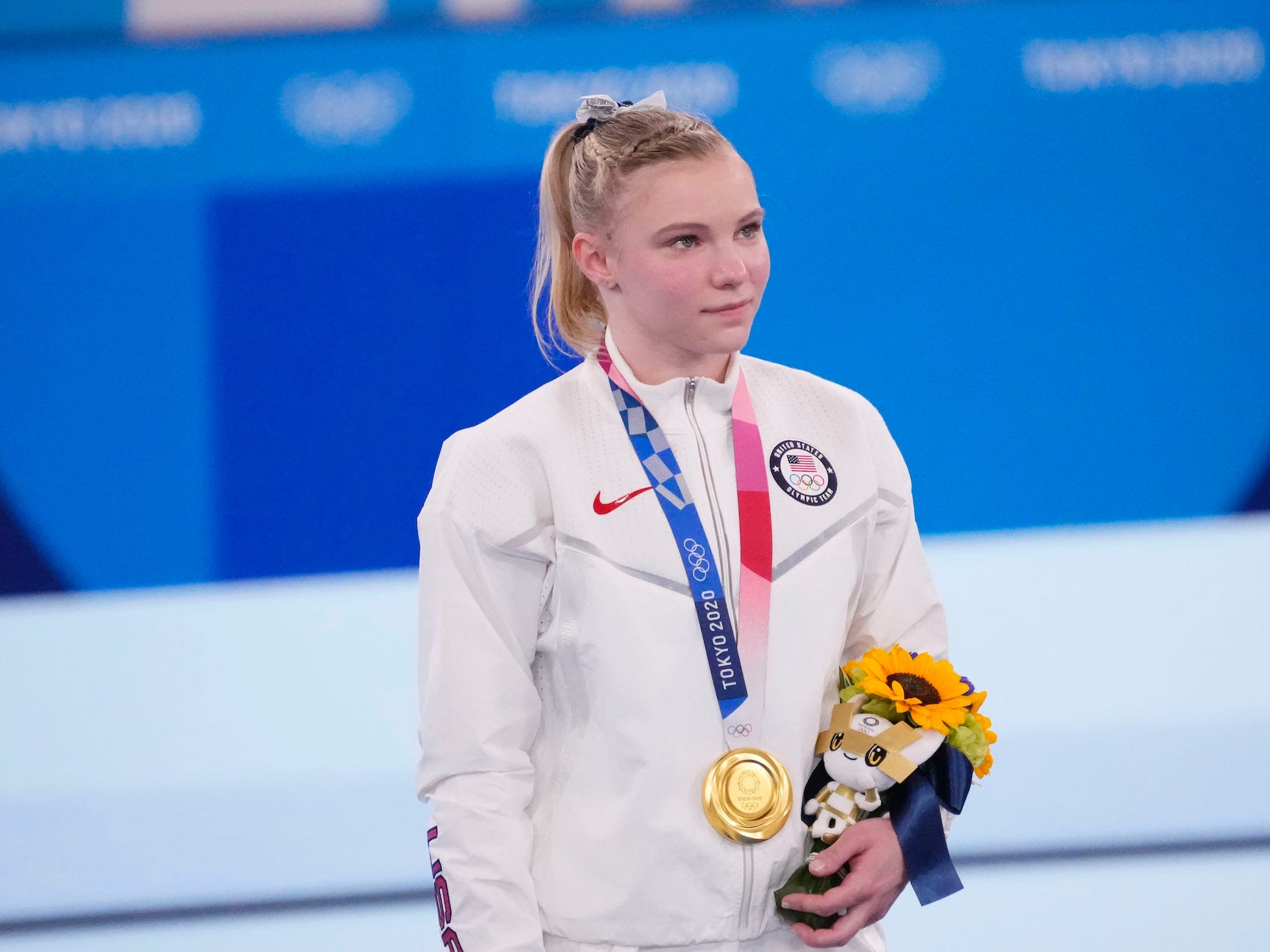Carey poses with her gold medal after the floor exercise final.