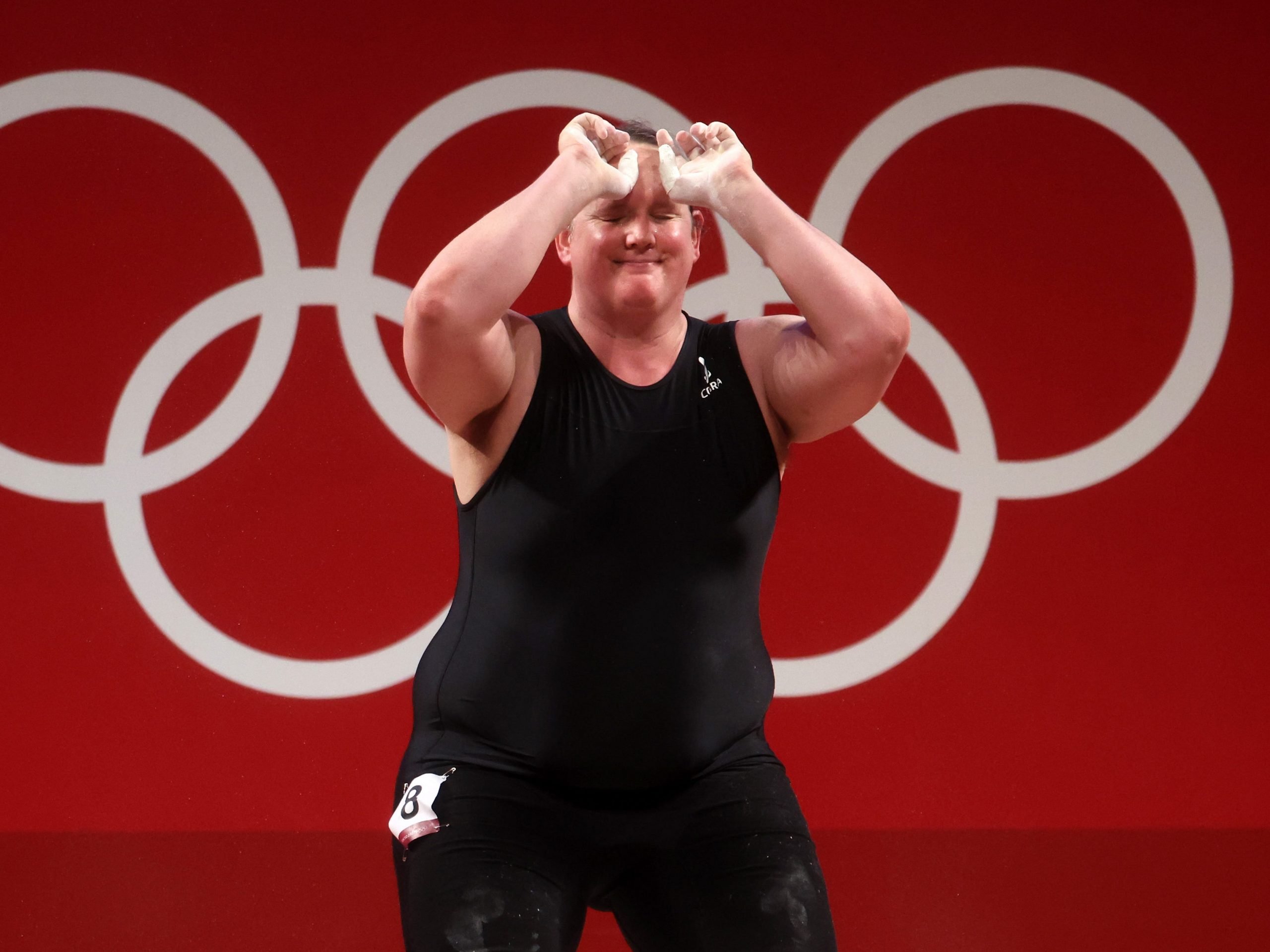 Laurel Hubbard reacts after missing out on an Olympic medal