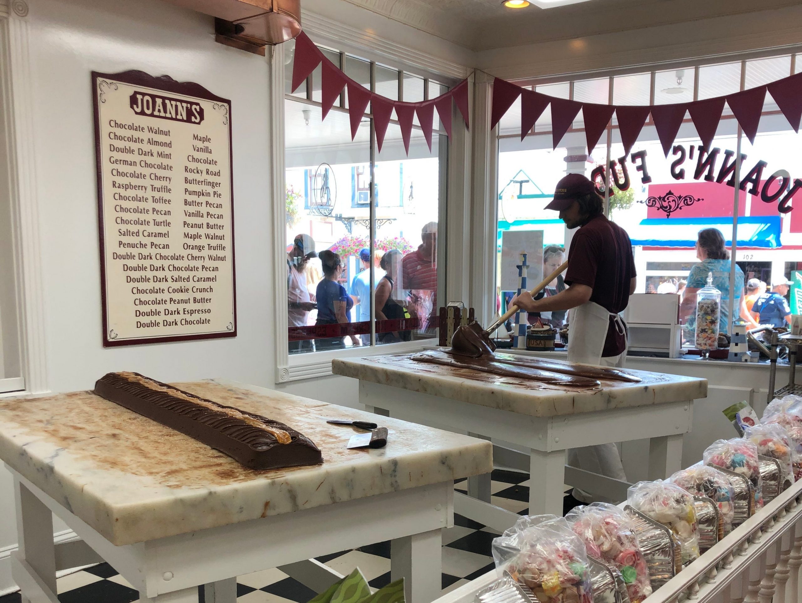 Someone in a shop making fudge