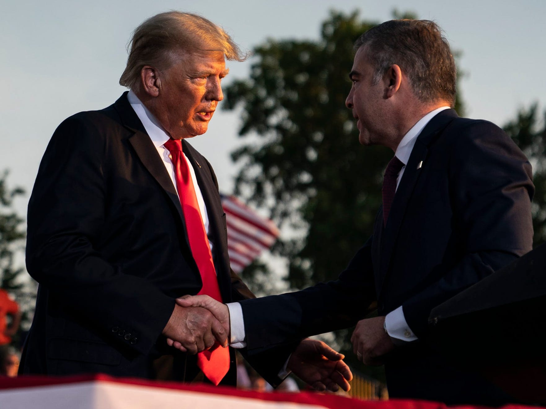 Donald Trump greets Mike Carey in Ohio