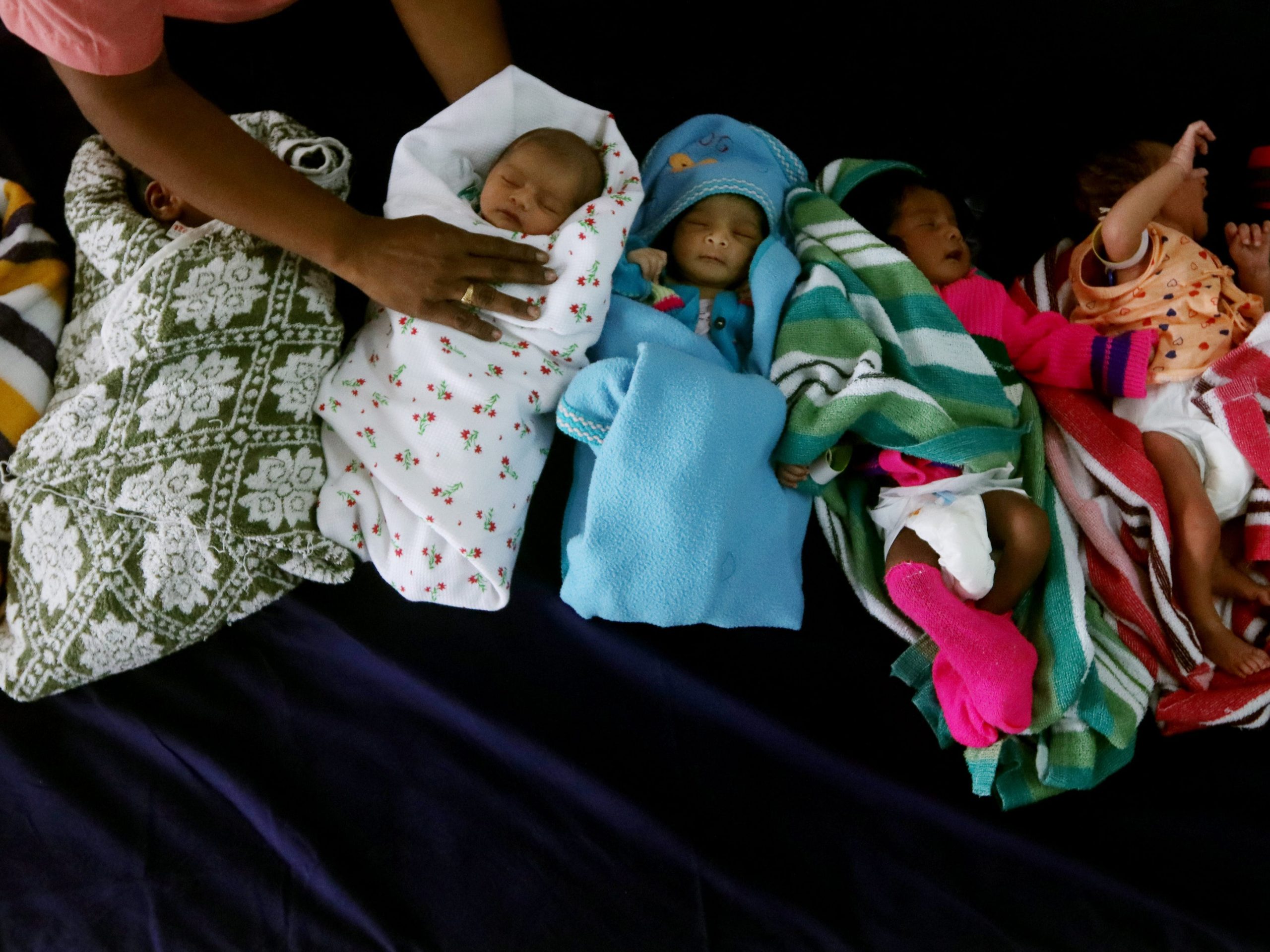 Newly born babies rest inside a ward on the occasion of World Population Day at Government Children's Hospital in Chennai, India.