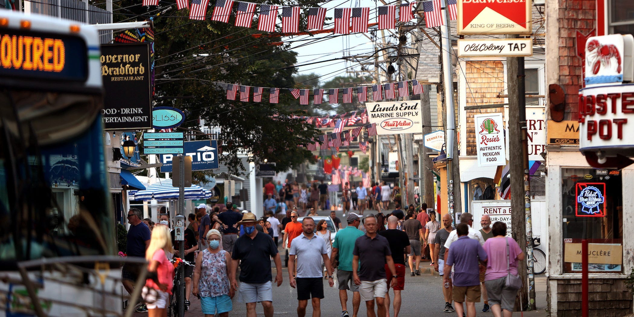 commercial street in provincetown draped with flags