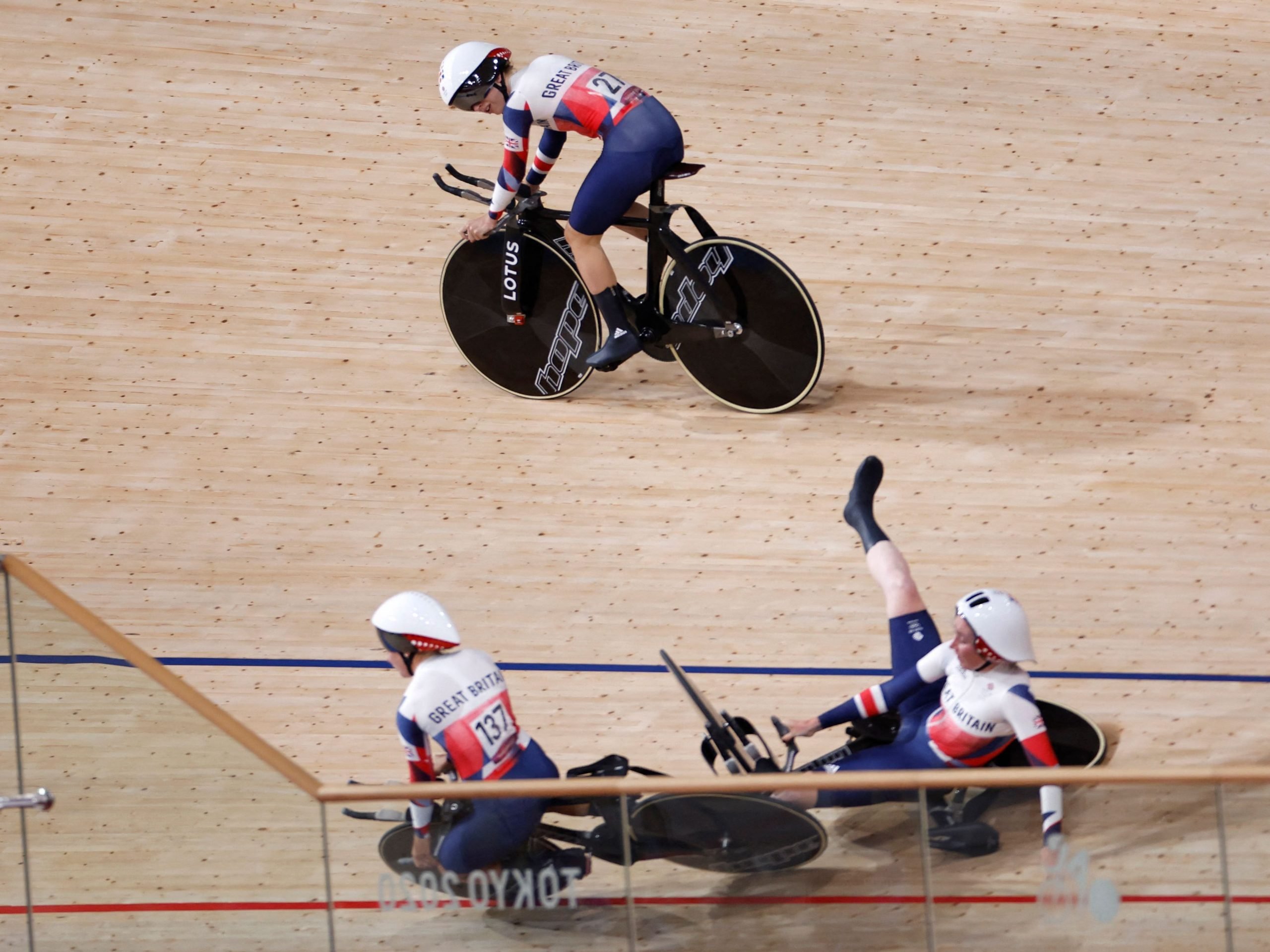 Jason Kenny looks as Neah Evans and Katie Archibald crashes