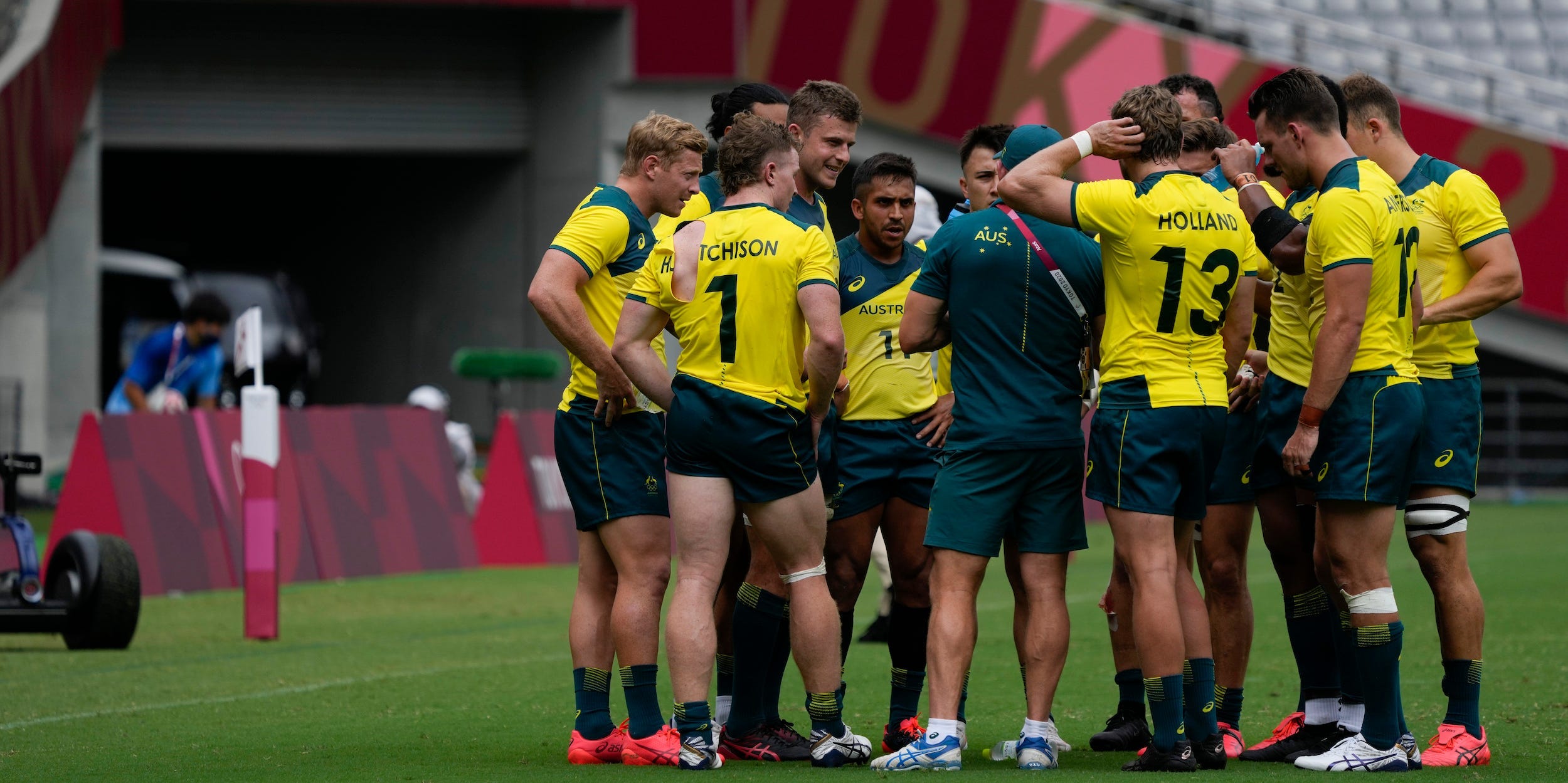 Australia players huddle up after losing their men's rugby sevens match against New Zealand at the 2020 Summer Olympics, Tuesday, July 27, 2021 in Tokyo, Japan.