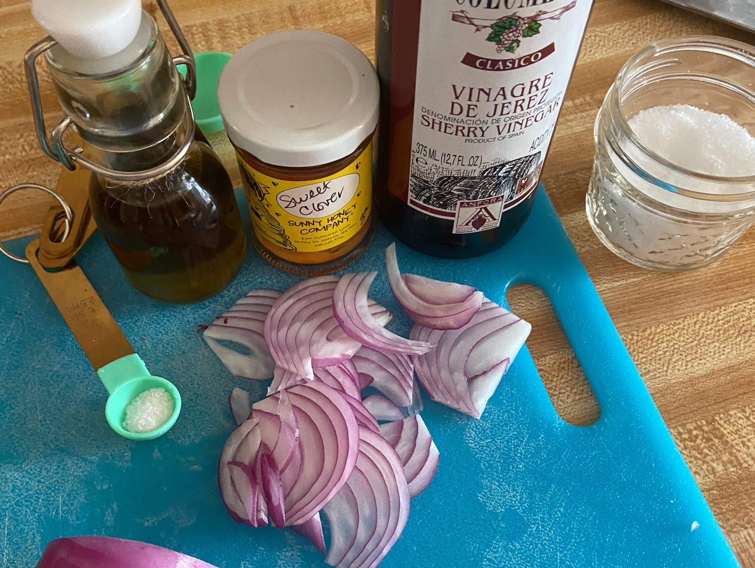 Ingredients for the viniagrette - onion, salt, olive oil, vinegar