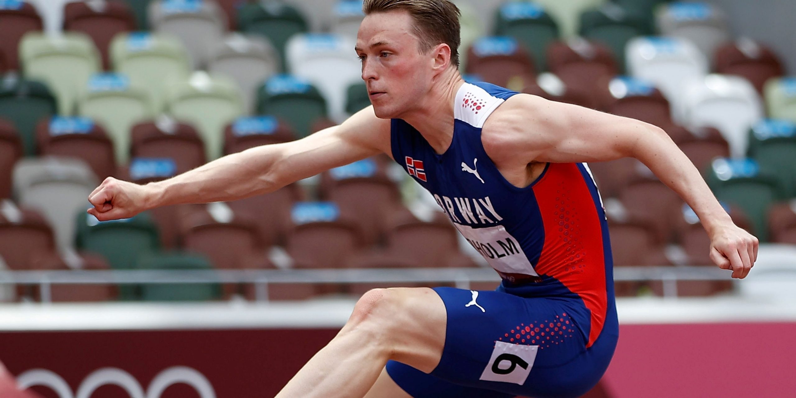 Karsten Warholm hurdling at the Tokyo Olympics.