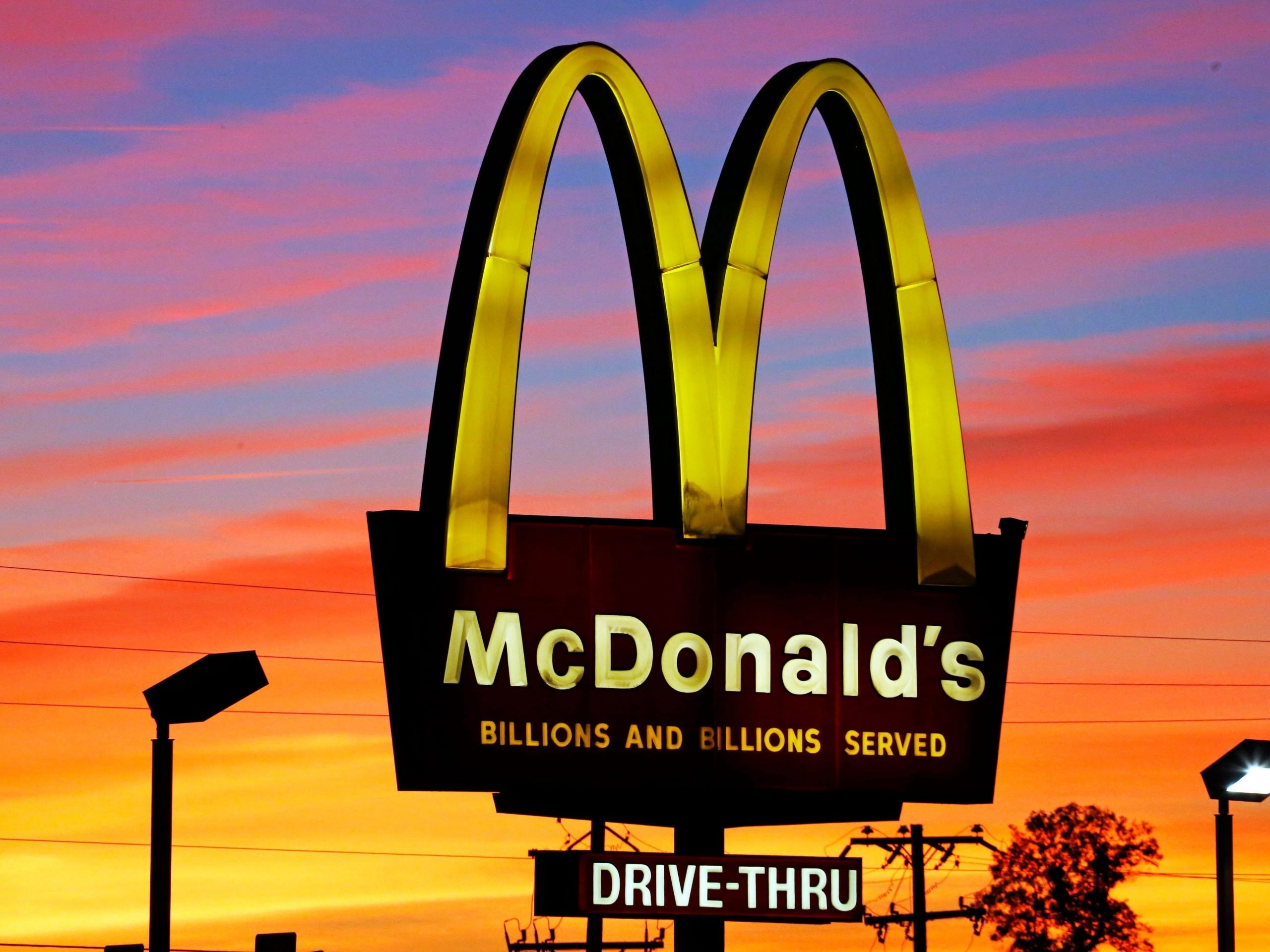 McDonald's arches in front of sunset
