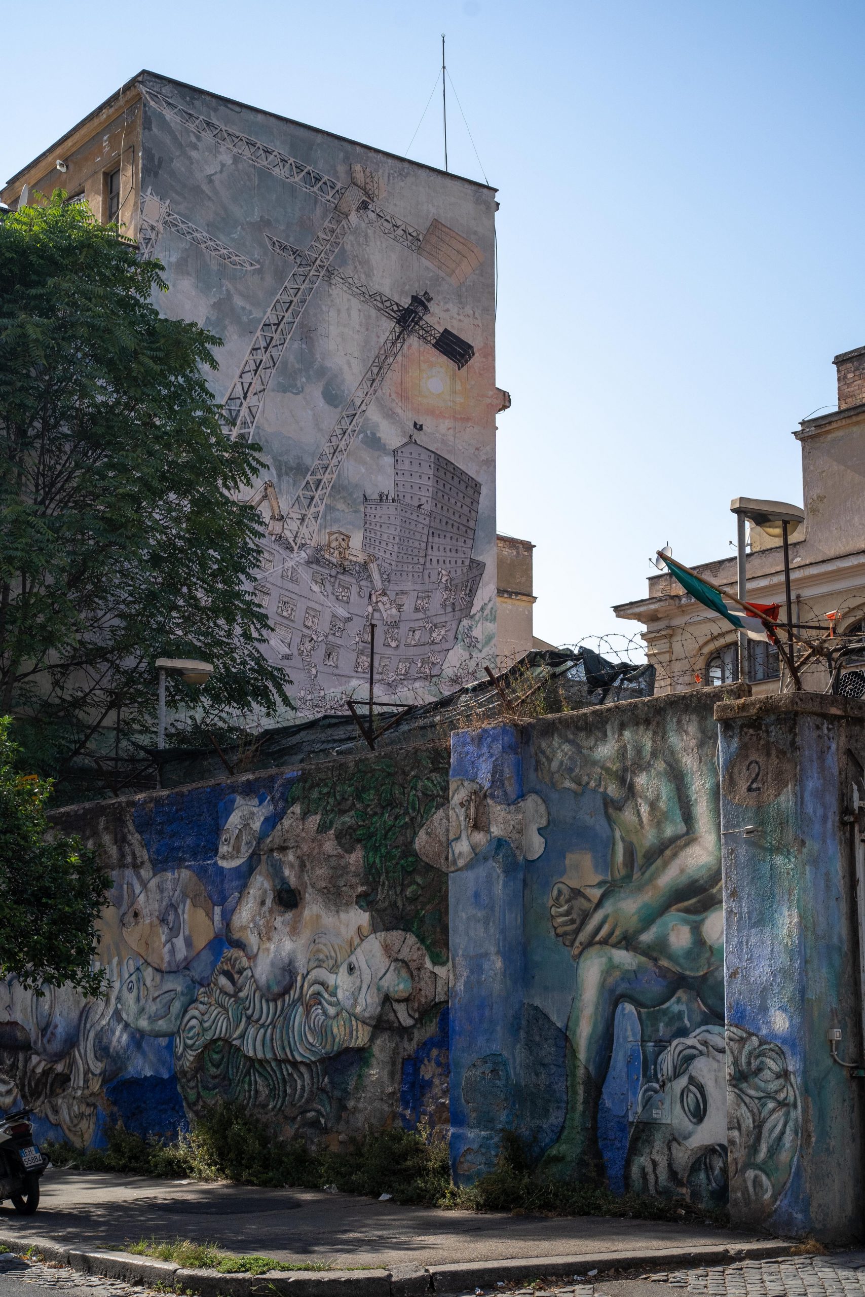 A huge mural shows a storm-rocked sailing ship under attack by pirates.