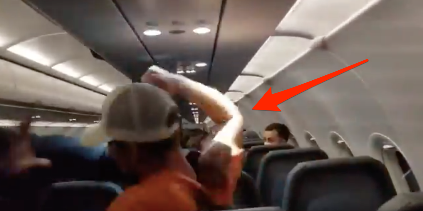 Frontier passenger raises fist before hitting flight attendant