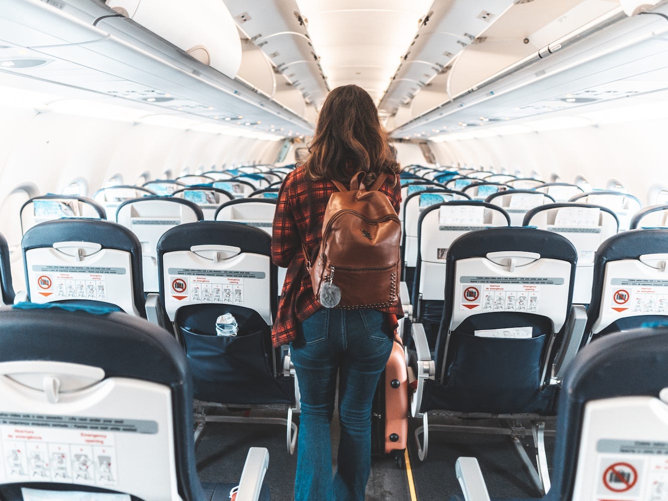 A person boards an airplane.