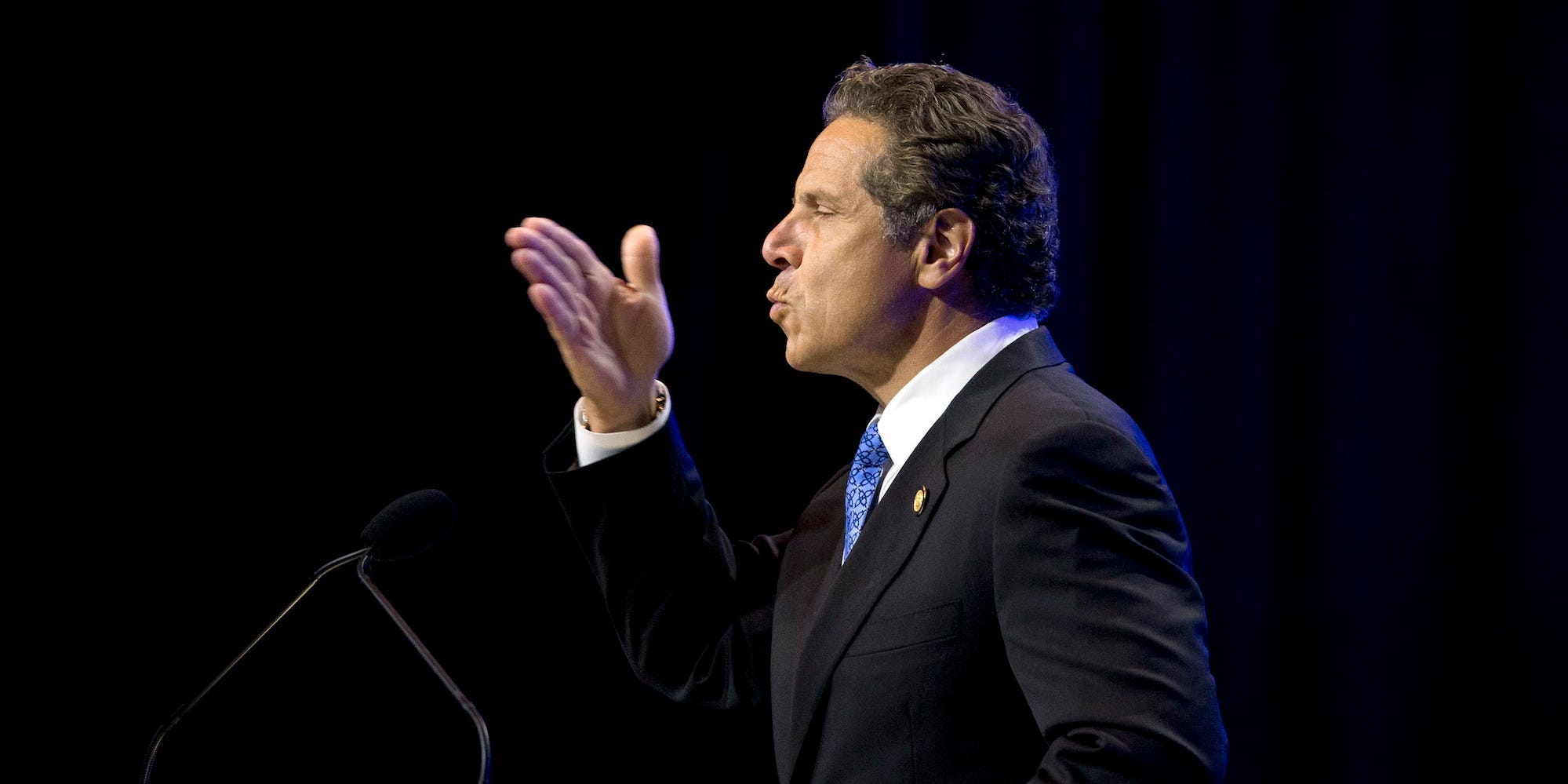 Andrew Cuomo blowing a kiss.