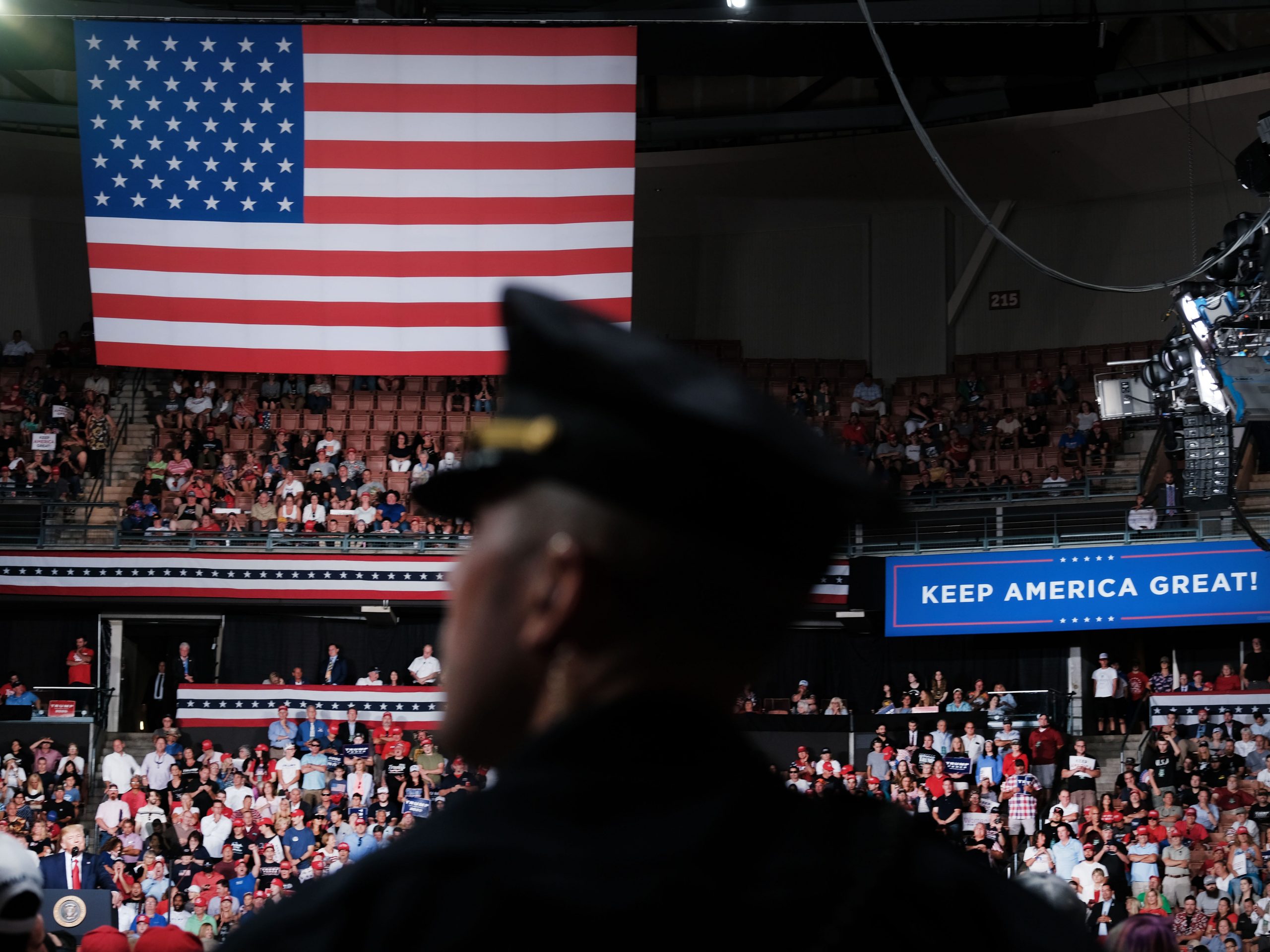 A police officer stands guard as President Donald Trump speaks to supporters at an evening rally on August 15, 2019 in Manchester, New Hampshire.